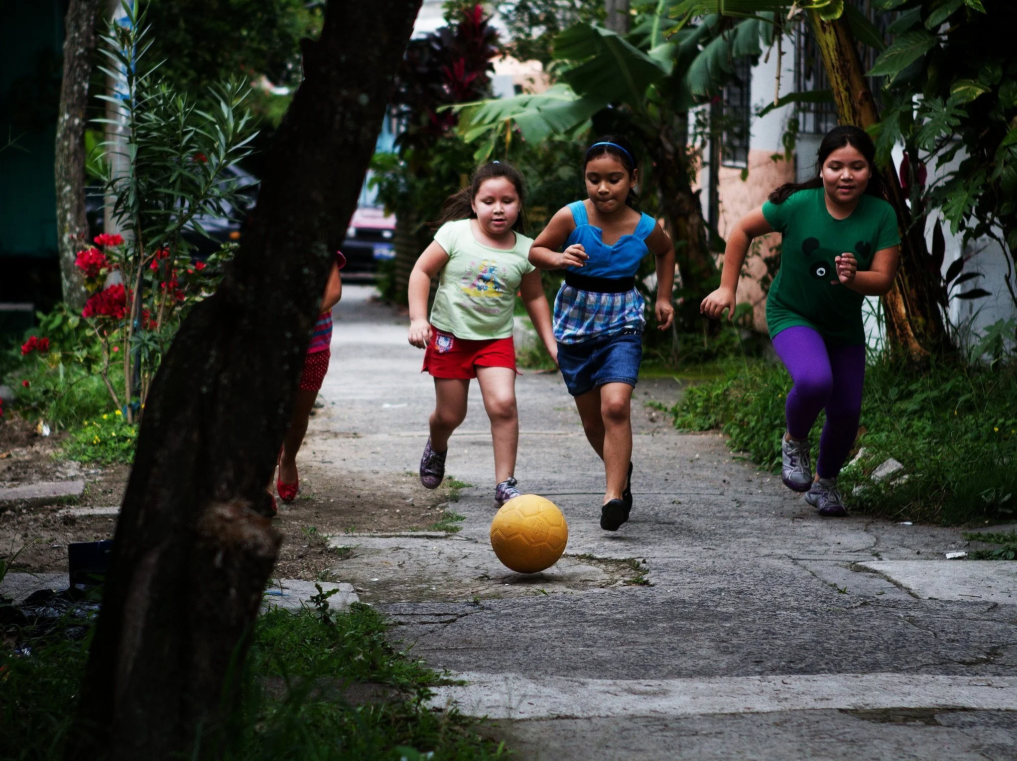 A02: Cut into the sequence on a longer lens as one of our kids puts a sick move on this friends to juggle out of danger with the ball.
