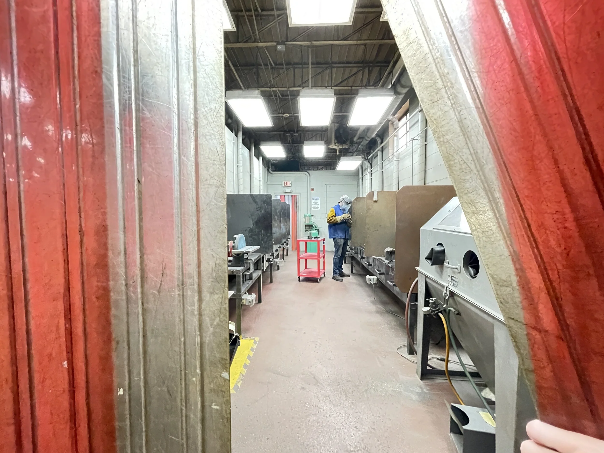 A012 - Dolly in on student 
ACTION: Grinding on a project from a wide shot