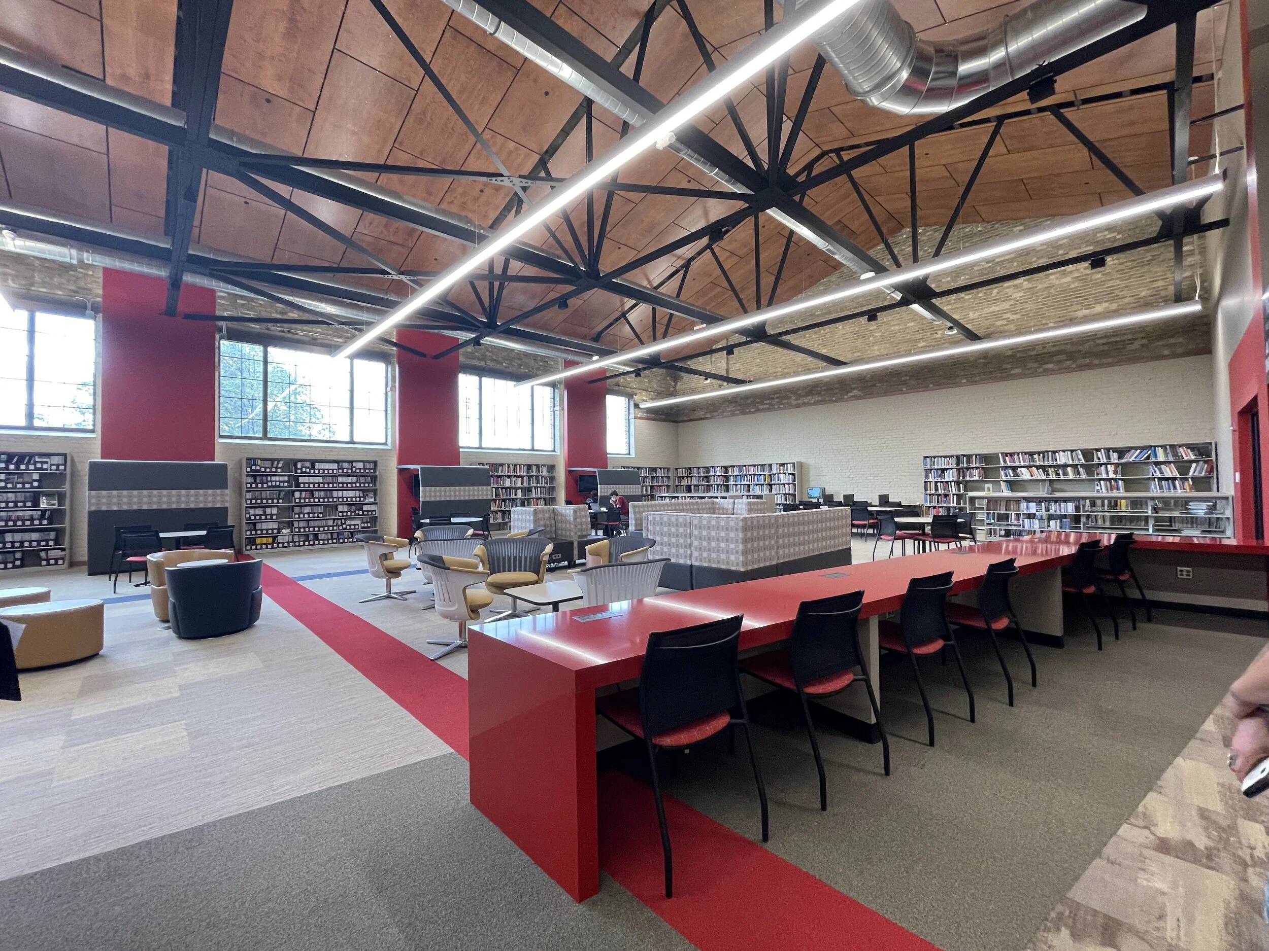 A007 -  Interior Design Student dolly in over shoulder
ACTION:  Student pulling research materials and mood boarding moves samples out of the way checks laptop