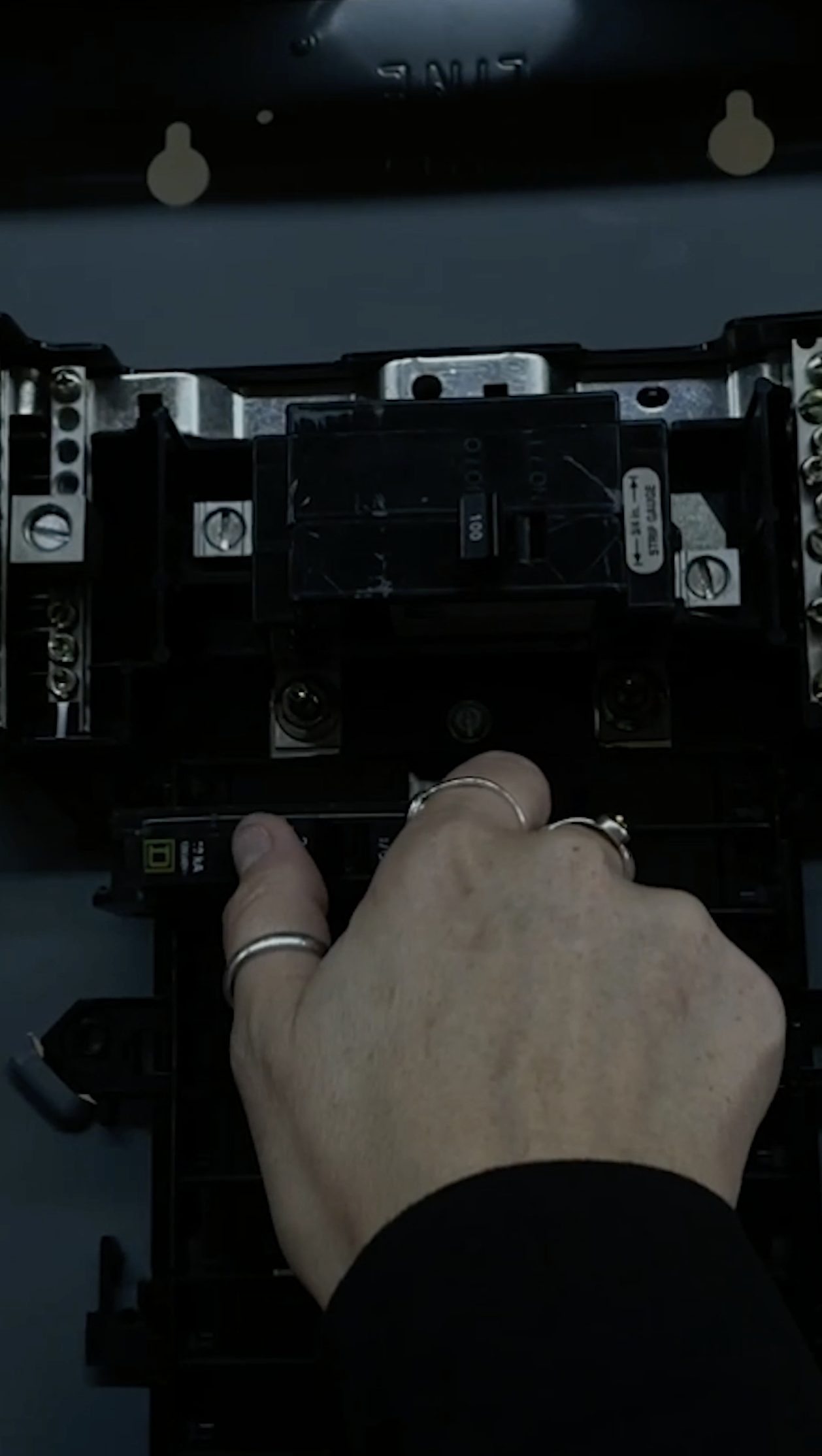 Shot 4- Construction - Hand moves up to wire or swap a breaker