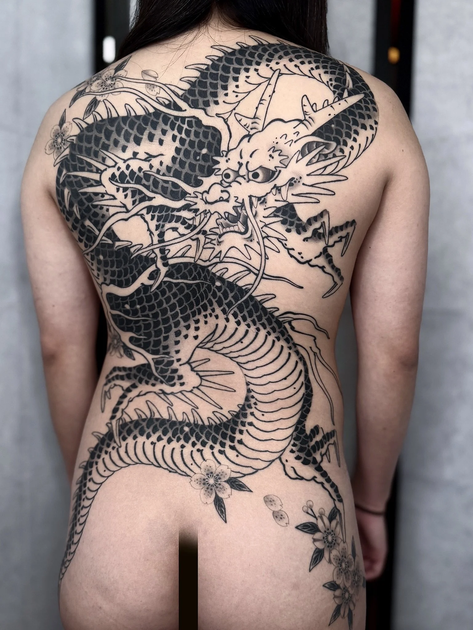 Bec&rsquo;s dragon. Thanks for trusting me to do your first tattoo! 

Booking link in bio. 
Tattooed @lighthouse_tattoo 

#dragon #japanese #blackwork #flowers #tattoo