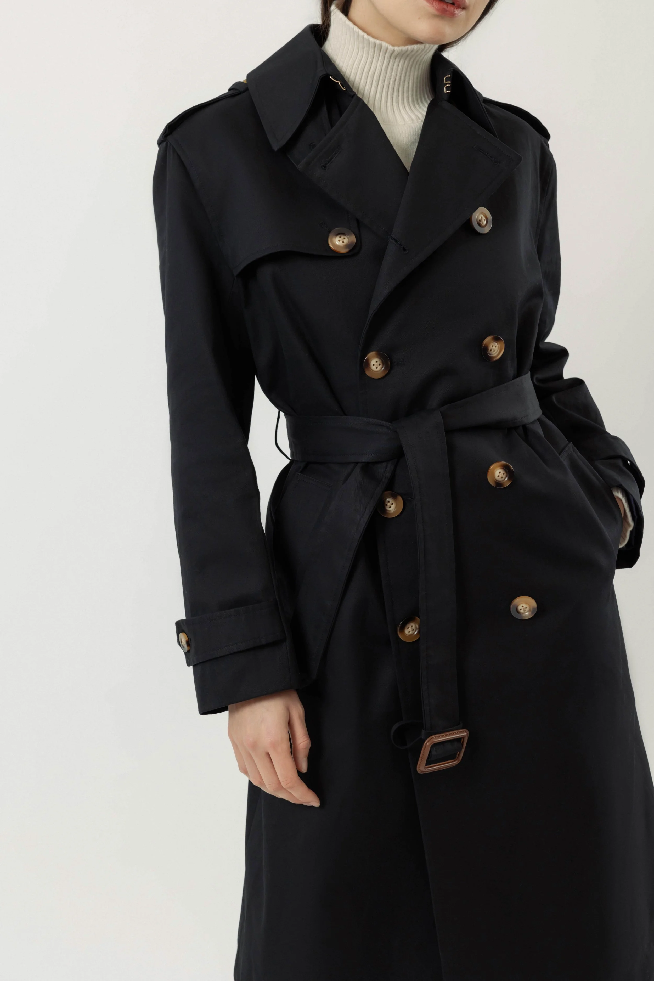 Close-up of Roz x Heather Lynn navy organic cotton trench coat, collar and belt details