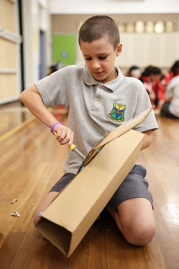 students creating a cardboard prototype