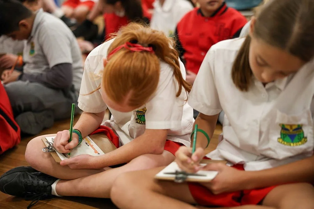 Students writing messages to the future