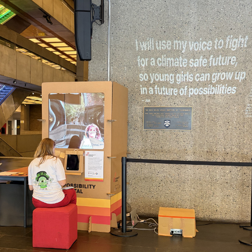Woman typing a promise into the Possibility Portal