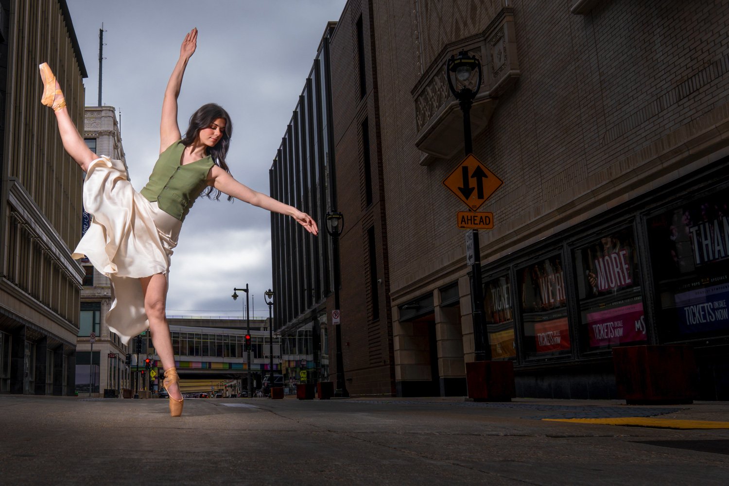 charlie james photo -milwaukee editorial portrait photographer - 2026 - koree dancing in downtown milwaukee urban landscape street portrait.jpg