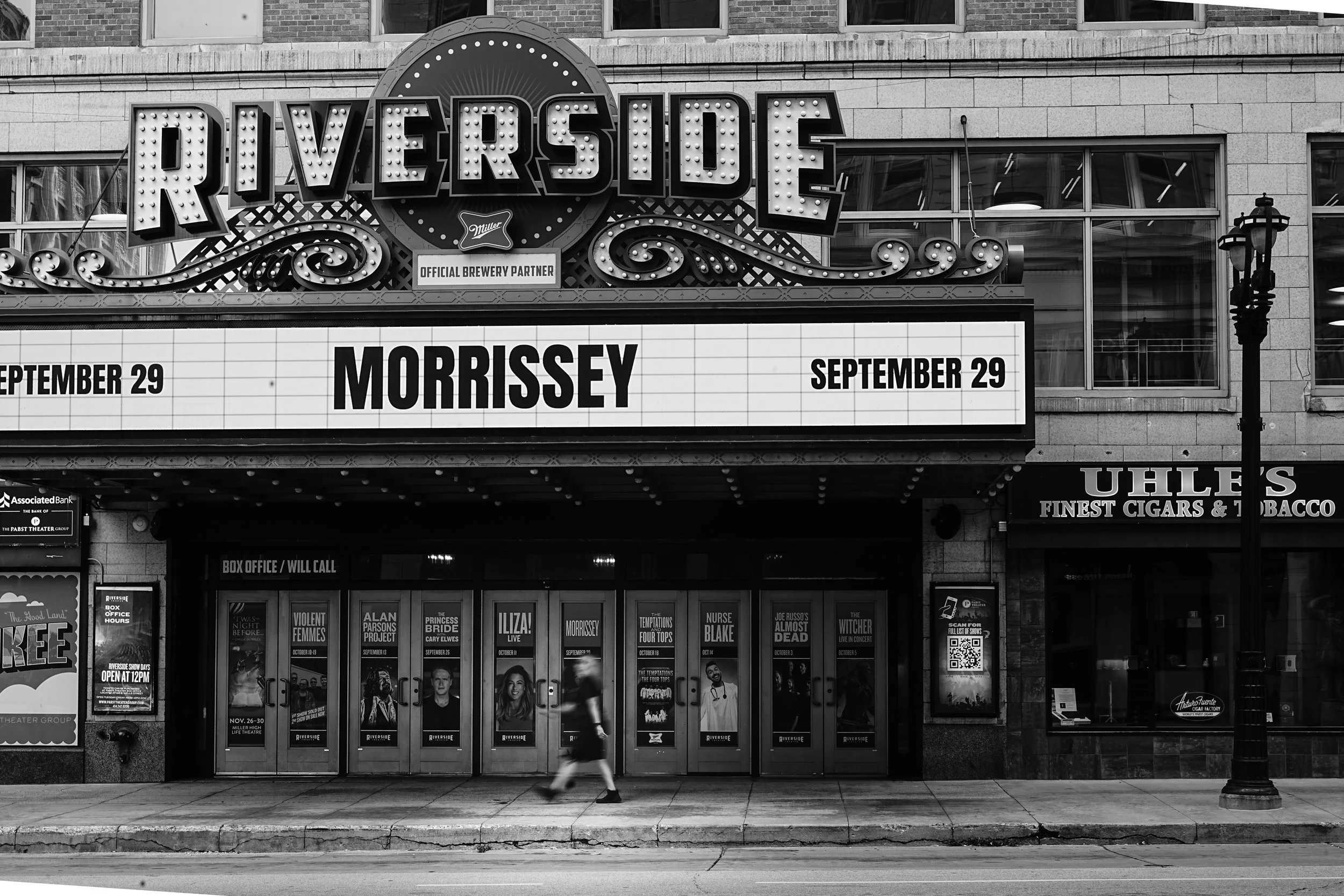 Exterior of the Riverside theater with a marquee advertising Morrissey's concert on September 29, black and white photo.