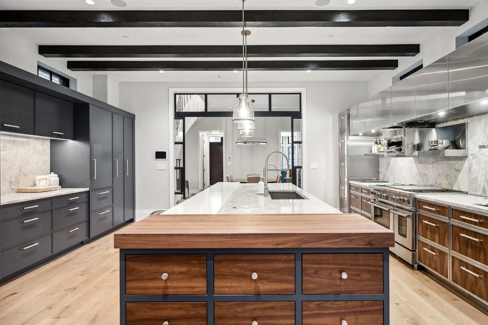 A custom-crafted bespoke walnut kitchen island at the Lincoln Park Wonderland project, showcasing multi-functional high-end cabinetry.
