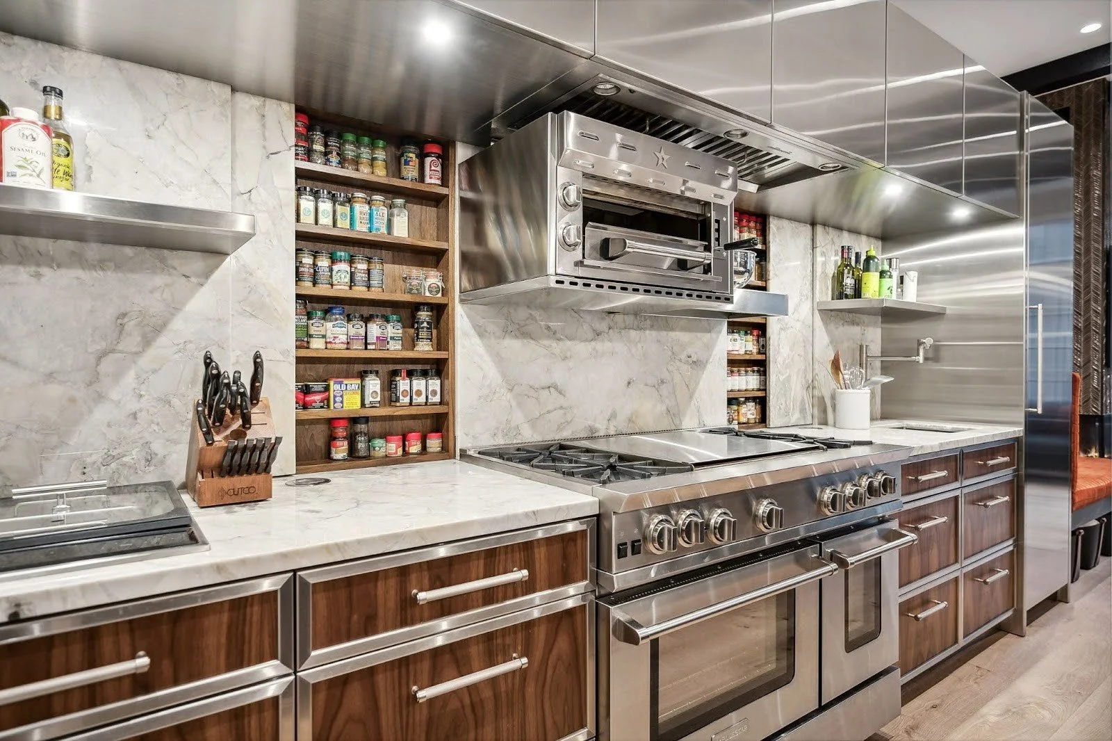 Bespoke invisible spice rack cabinets integrated seamlessly into a modern kitchen design at the Lincoln Park Wonderland project.