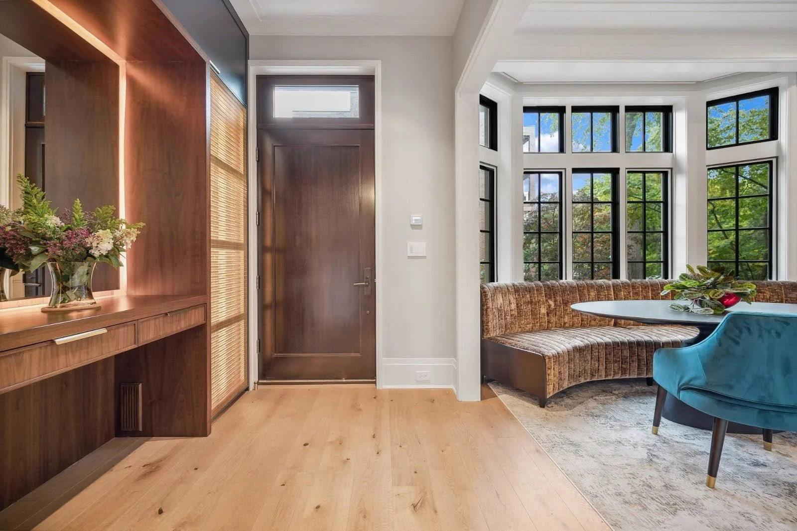 An informal dining banquette and kitchen island at the Lincoln Park Wonderland project, designed for casual, effortless socializing.