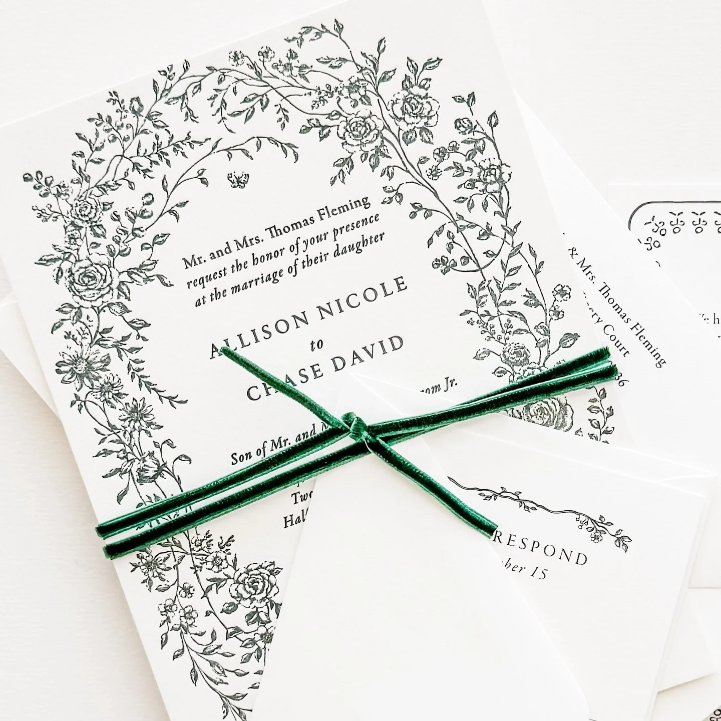 The Olivia design features beautiful illustrated florals in a wreath. Allison + Chase chose to wrap theirs in gorgeous green velvet!

Custom Bespoke Wedding Invitations / Save the Dates