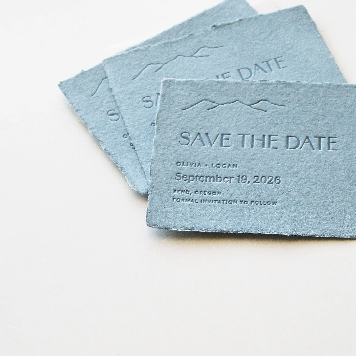 A simple, pretty blue handmade paper save the date! #bluehandmadepaper #bluesavethedate #augustandwhite
