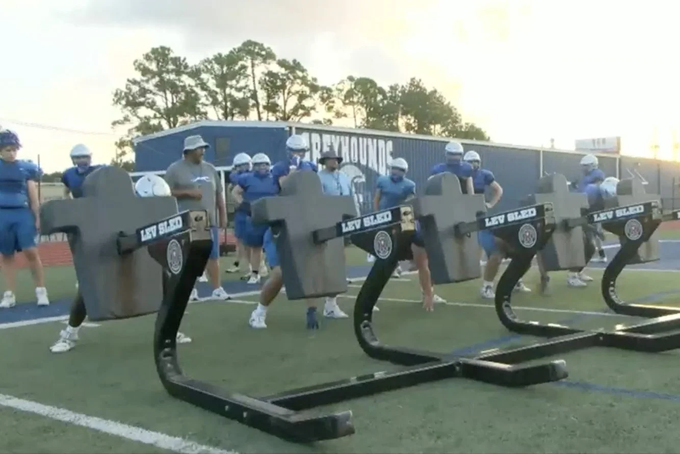 WLOX: Ocean Springs High School football team practices early to beat the heat