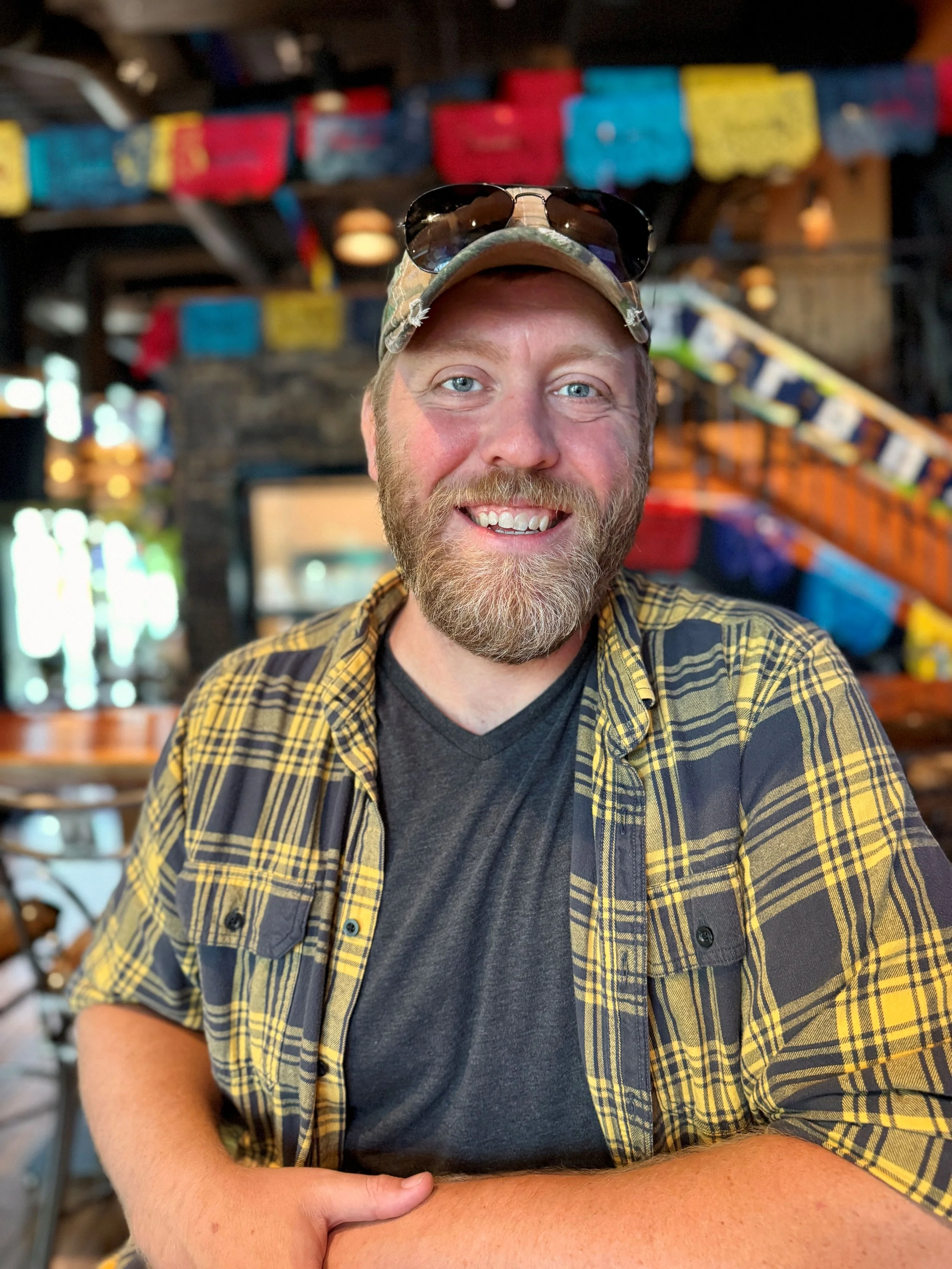Mike Van Someren in flannel at a restaurant.