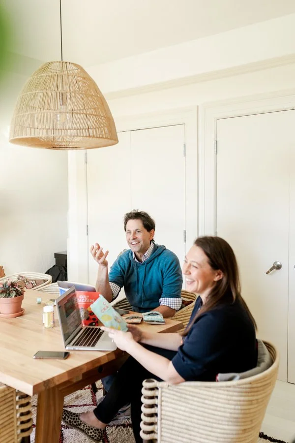 A packaged product founder working on a laptop