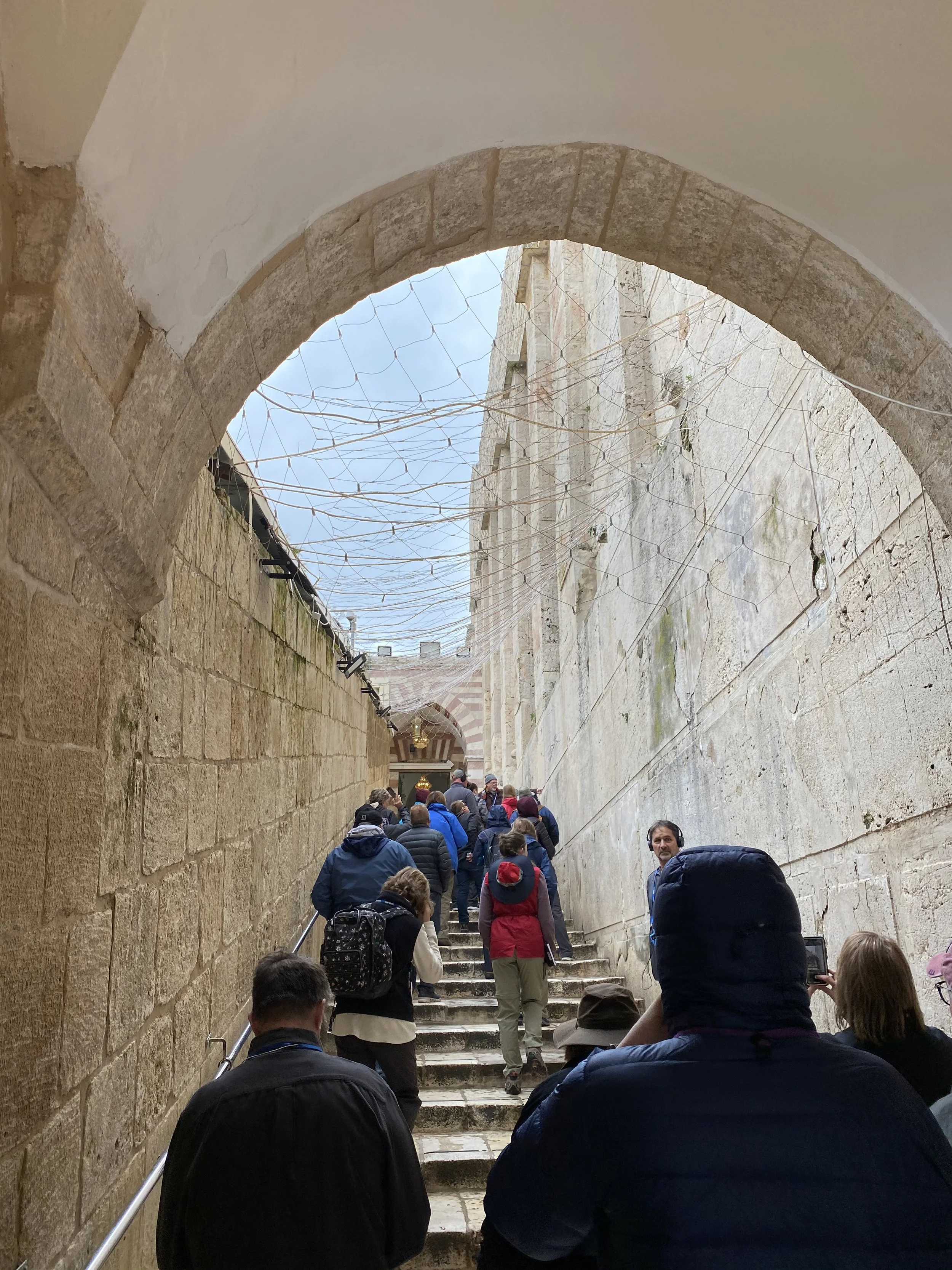 Climbing the stairs to get to the Mosque entrance