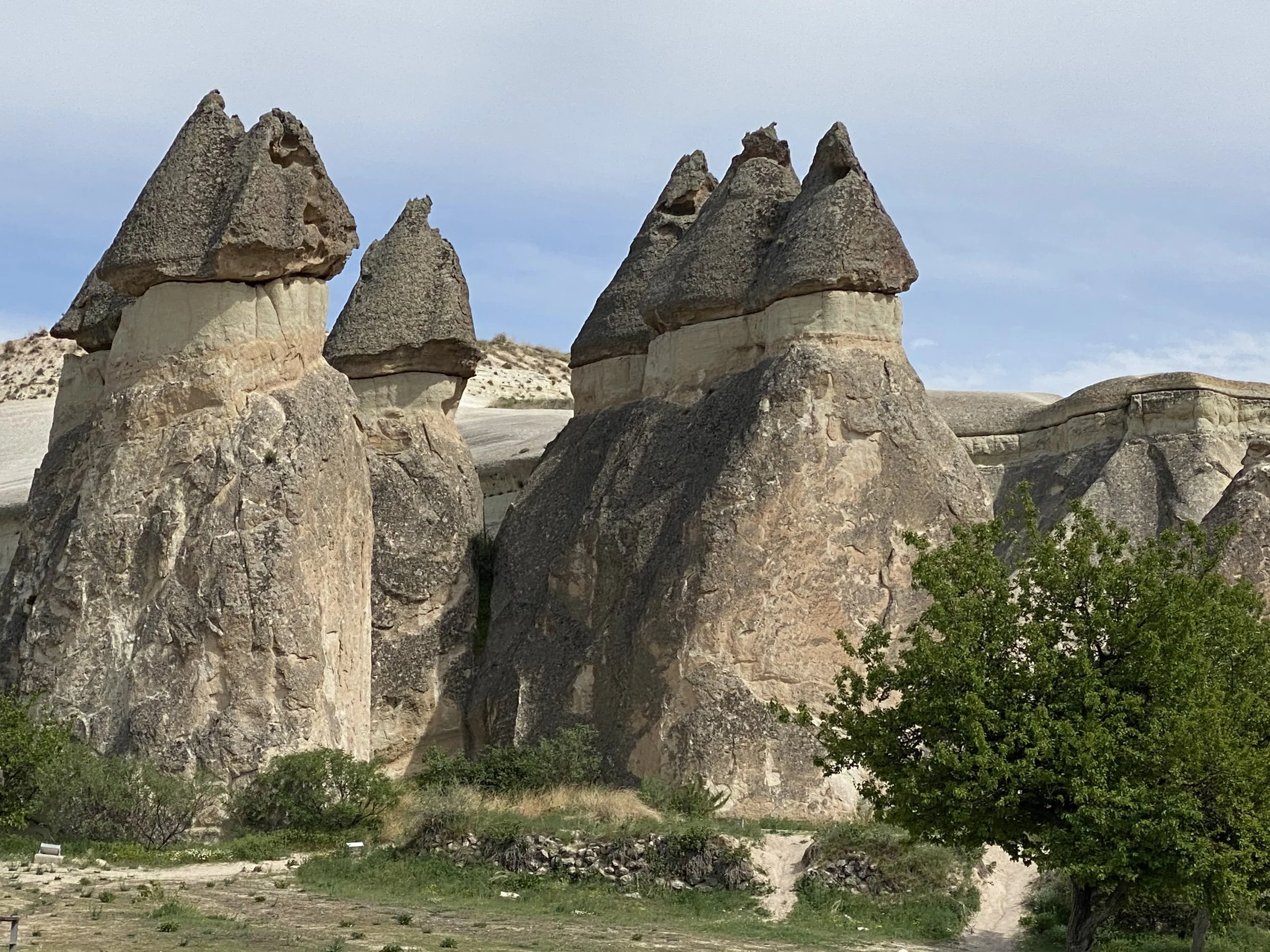 "Fairy Chimney" rock formations in Cappadocia.  Volcanic tuff with basalt caps shaped by wind and rain.