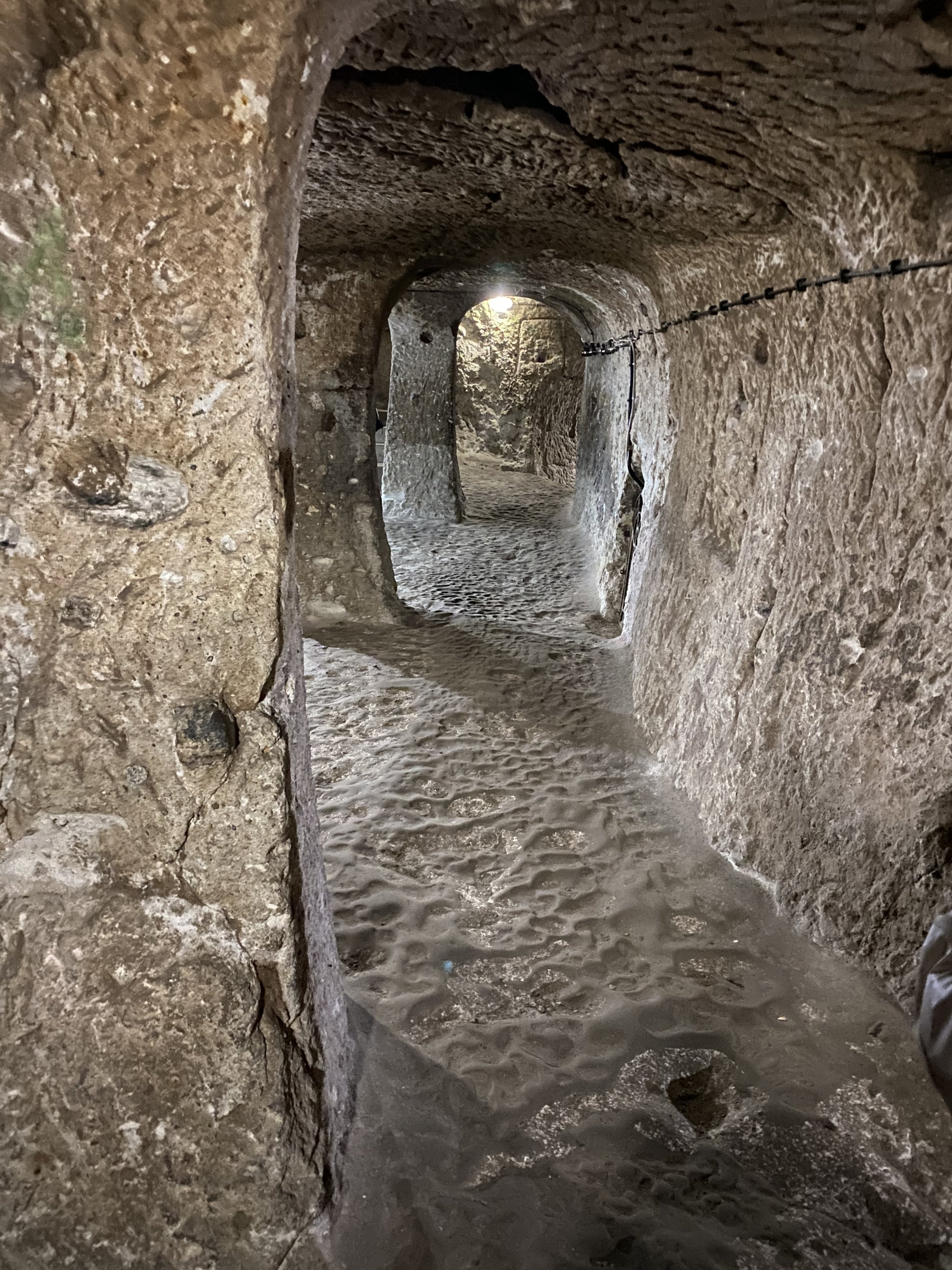 The floor looks sandy in pictures, but it is actually worn smooth and slippery by thousands of years of use, likely back to the 1200's BC and the Hittites.