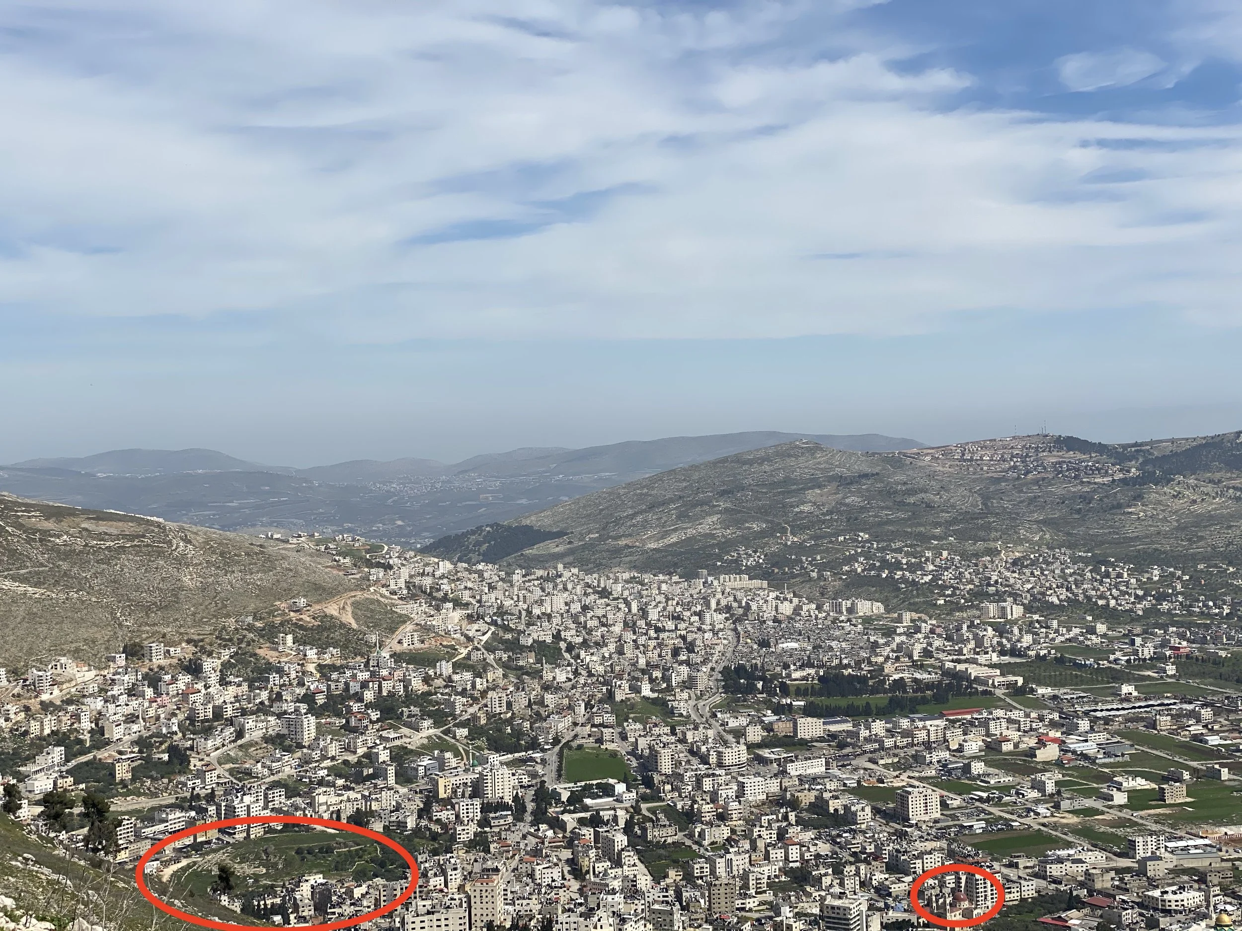 Standing on Mnt Gerizim looking down on modern day Nablus - archeological sites of Shechem and the church over Jacob's well are circled.