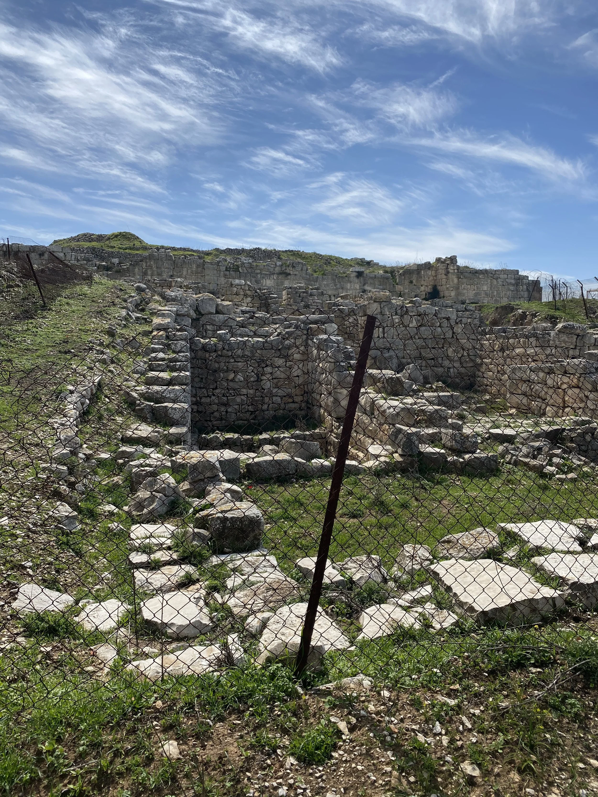 Looking through the fence at some of the ruins.