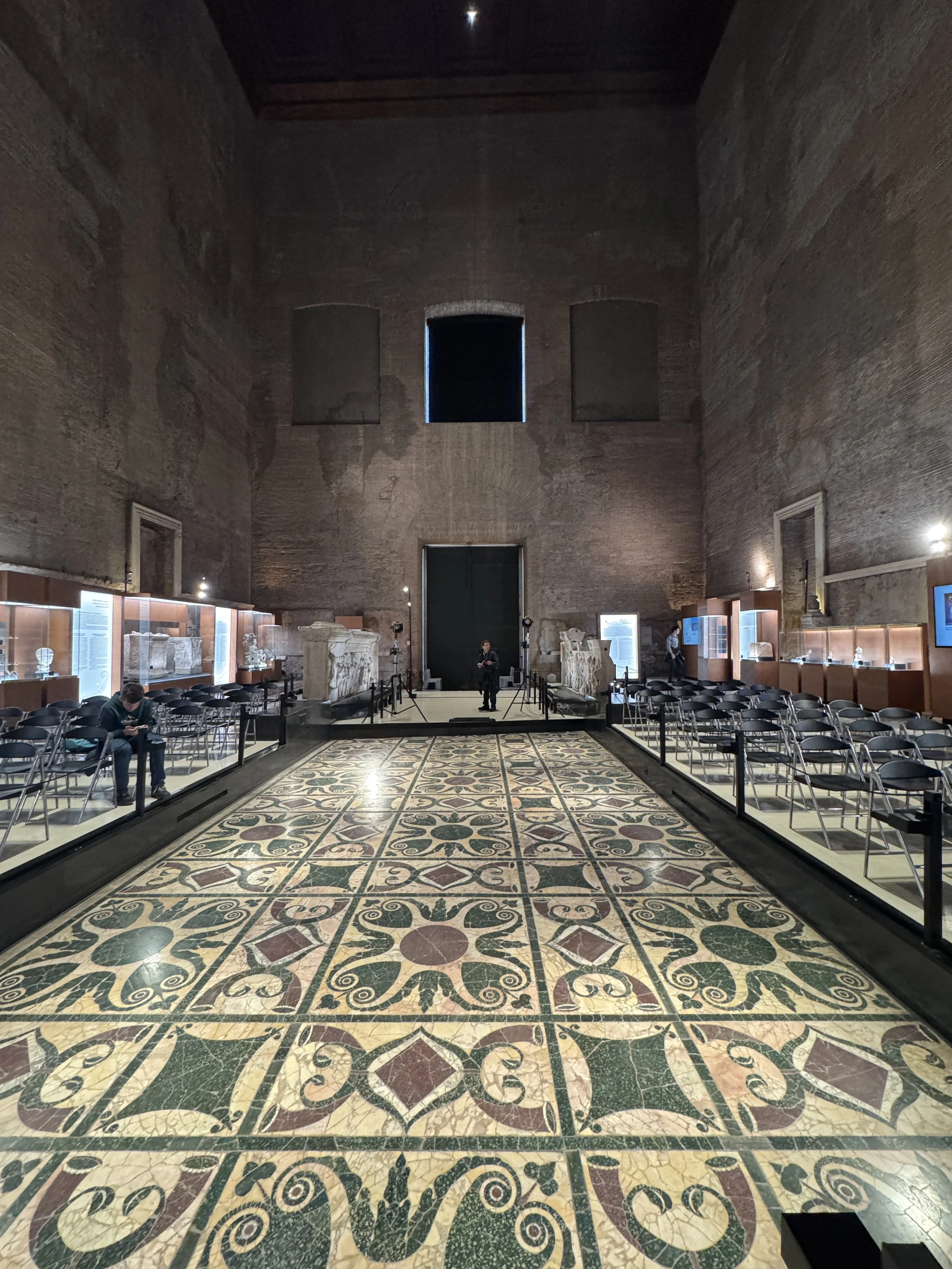 The curia, where the Roman senate met. The gorgeous floor is from a 280's AD renovation of the building. the building was built in 44BC