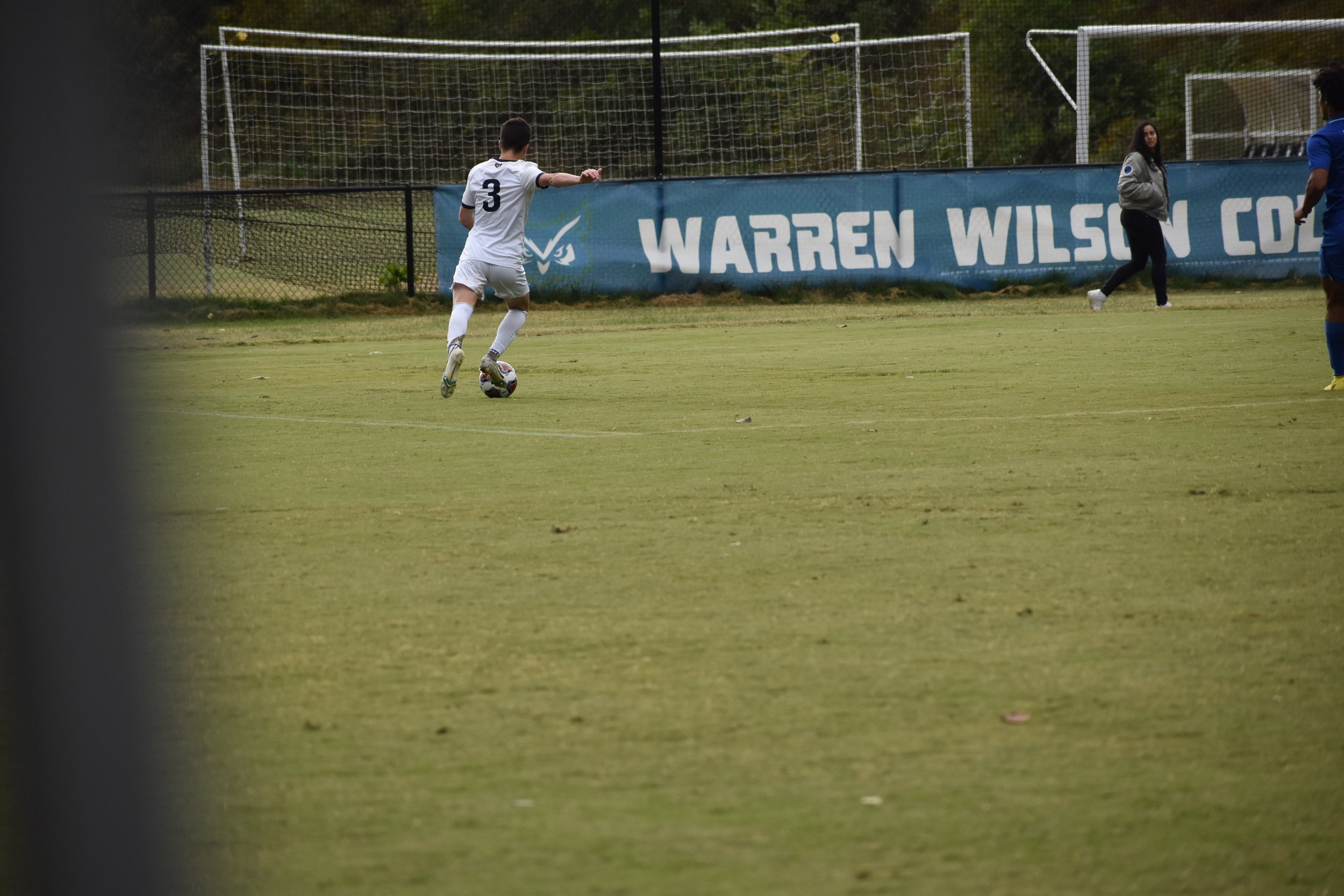  Freshman John Rhoden sends a cross from the left during Saturday’s homecoming loss to Johnson and Wales.    