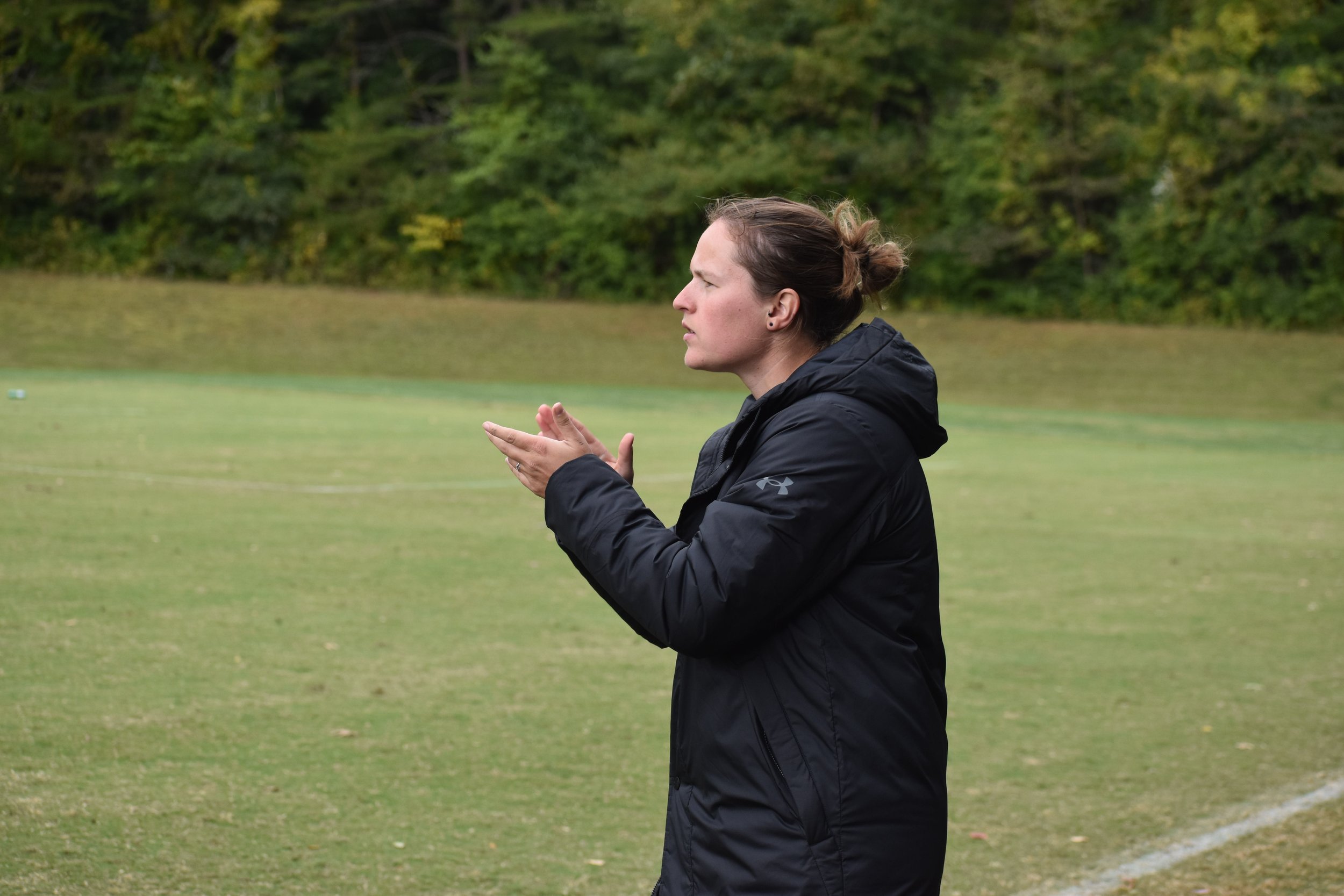  Kendall Baird, the head men’s soccer coach cheers the owls on during their match against Johnson and Wales. 