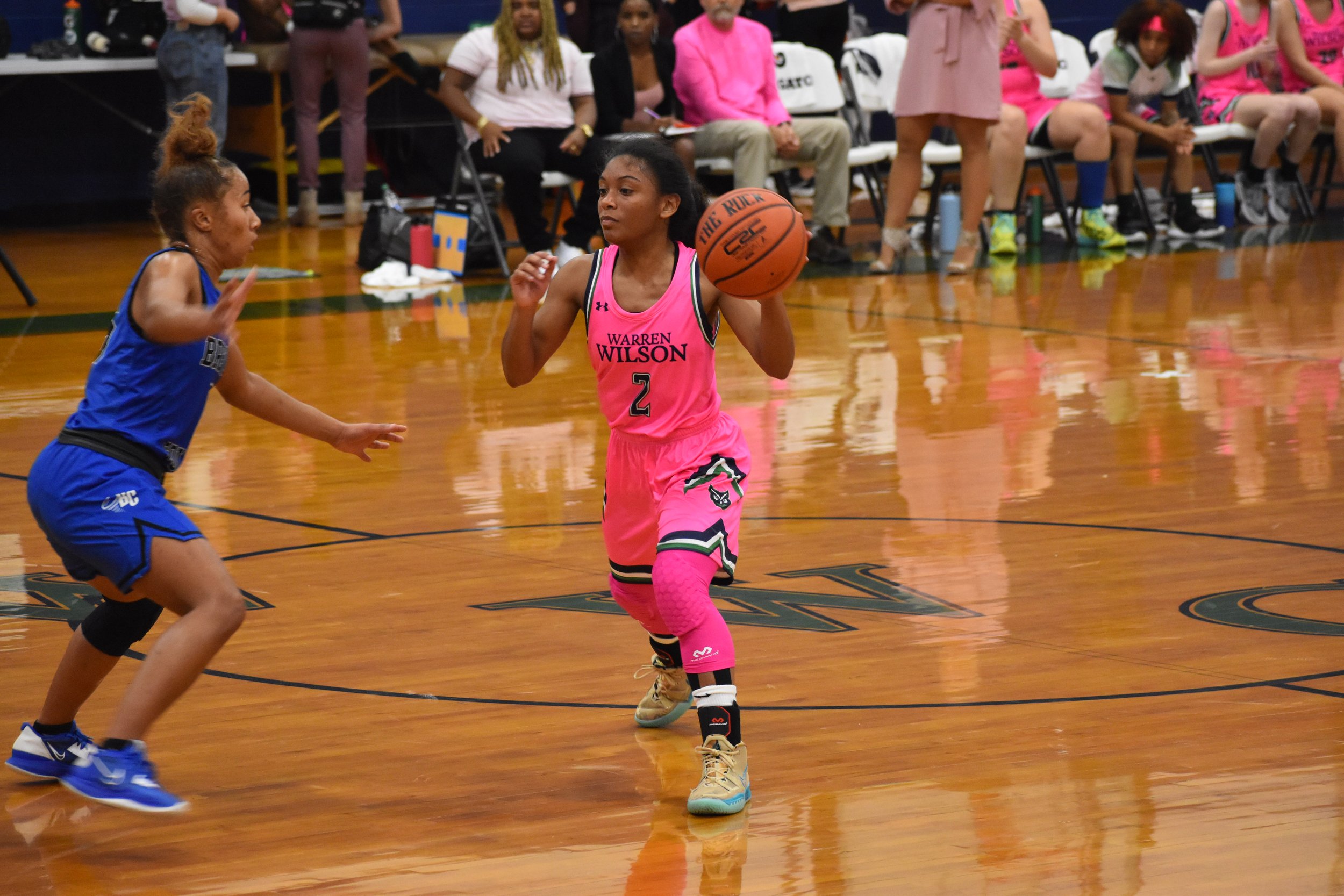  Carmen Echols taking the ball down the court. 