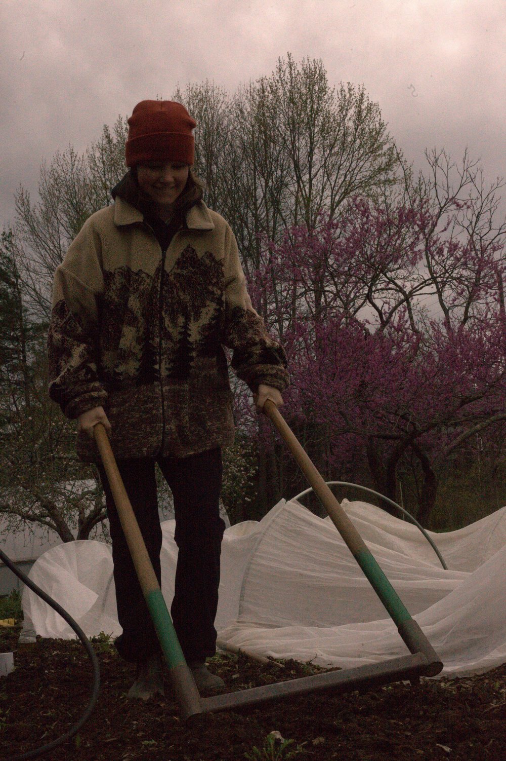  Jocie Funderburk uses a broadfork to prepare the soil. 