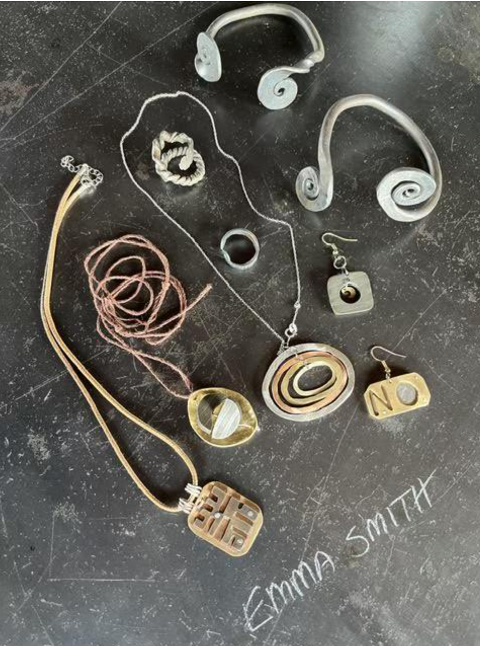  Several pendants and earrings and a forged cuff bracelet by Emma Smith. 