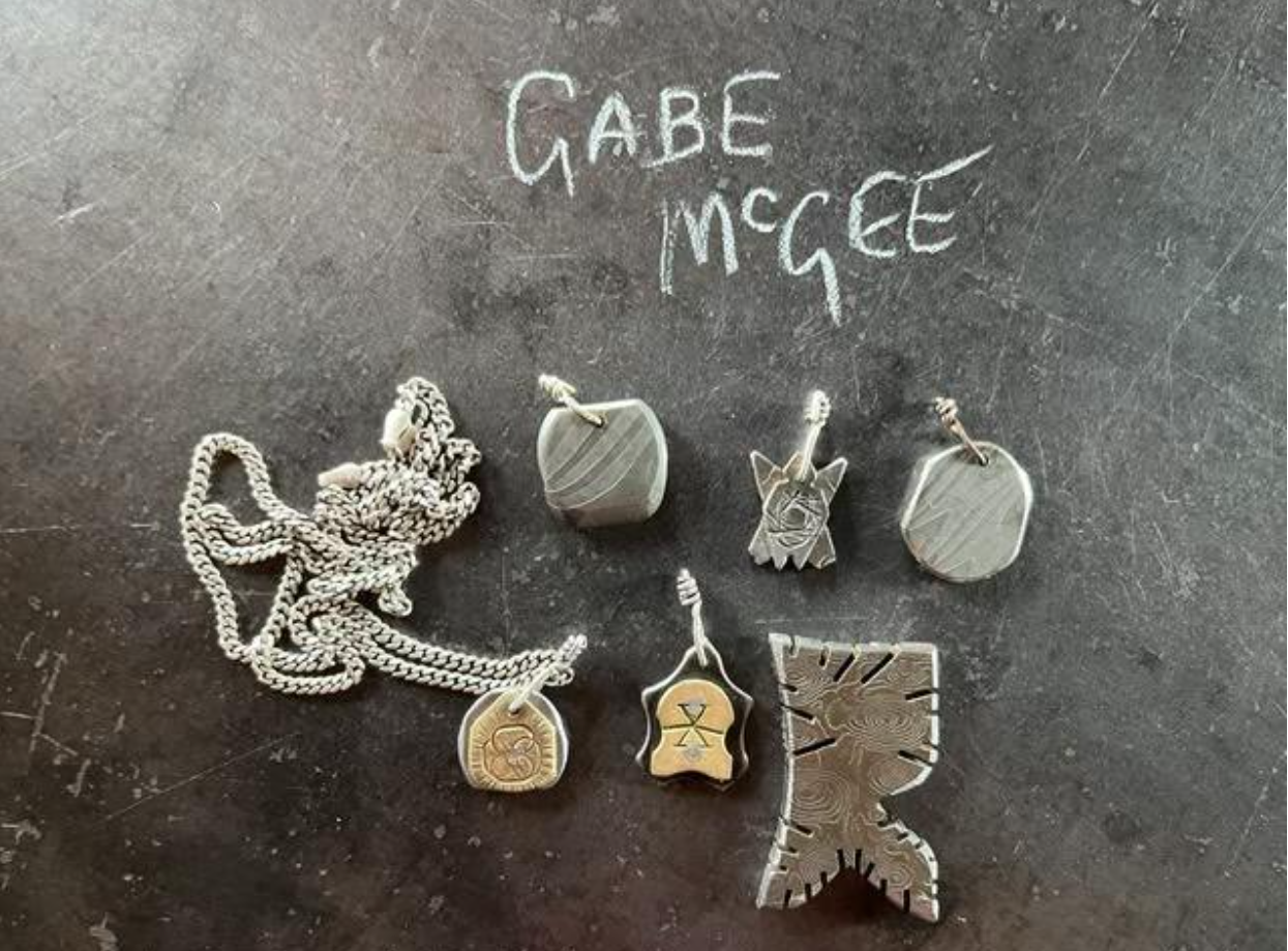 Pendants and experimental Damascus piece by Gabe McGee. 