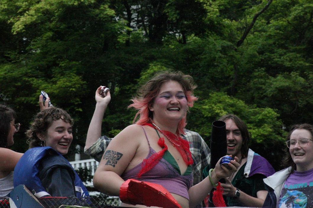 Natalie Kloss smiles on the CORE float 