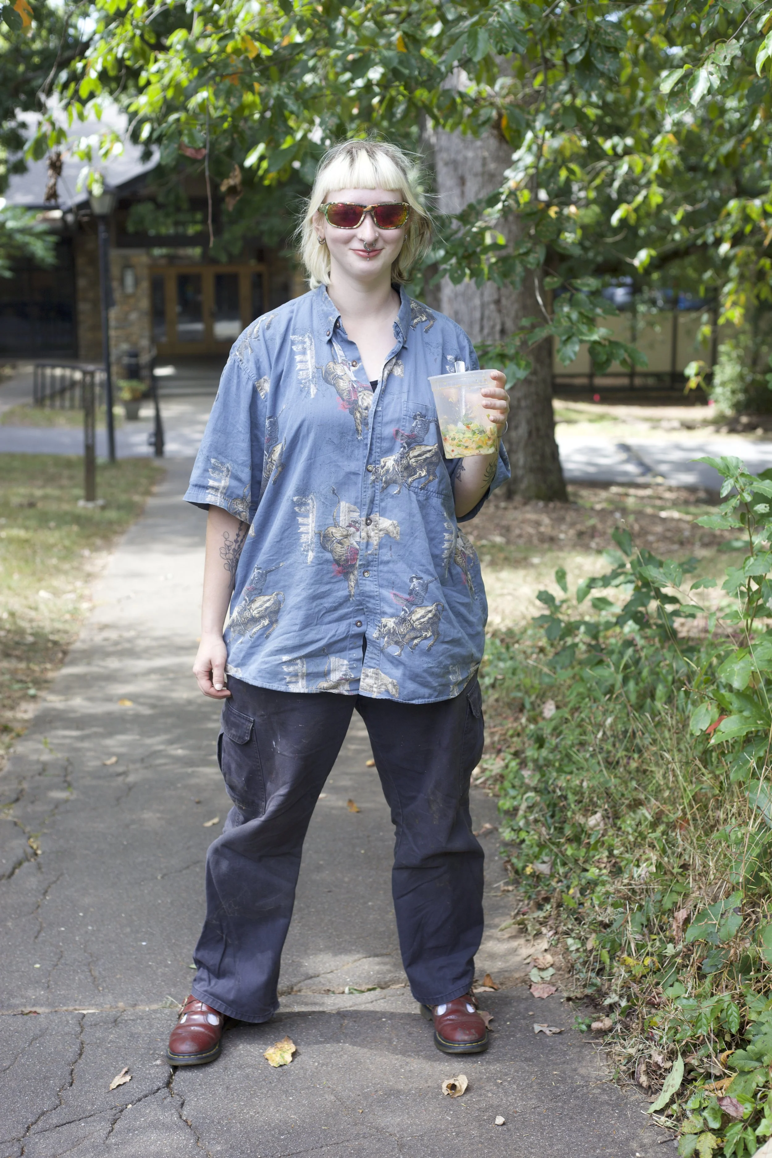Fresh off of her shift on Cattle Crew, Ursula Curlin’s work outfit features her cow shirt and Pit Viper sunglasses.
