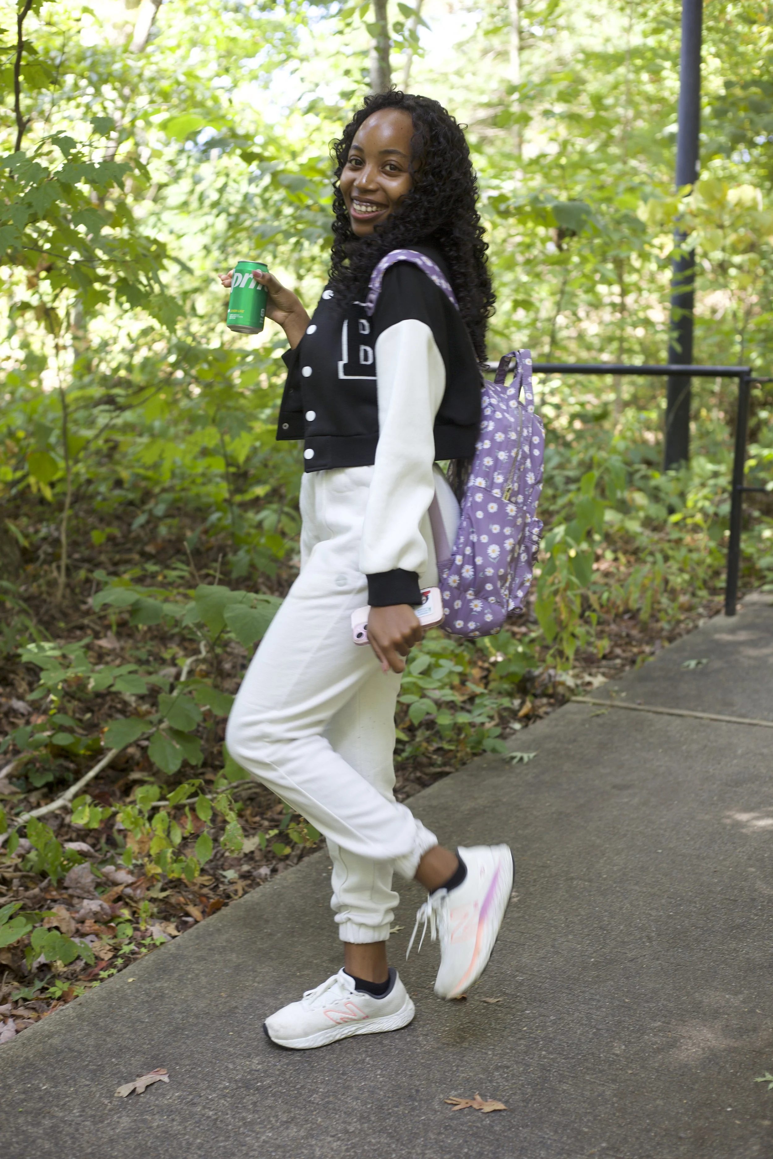 Rose Nhira smiles for a photo on the way to class.