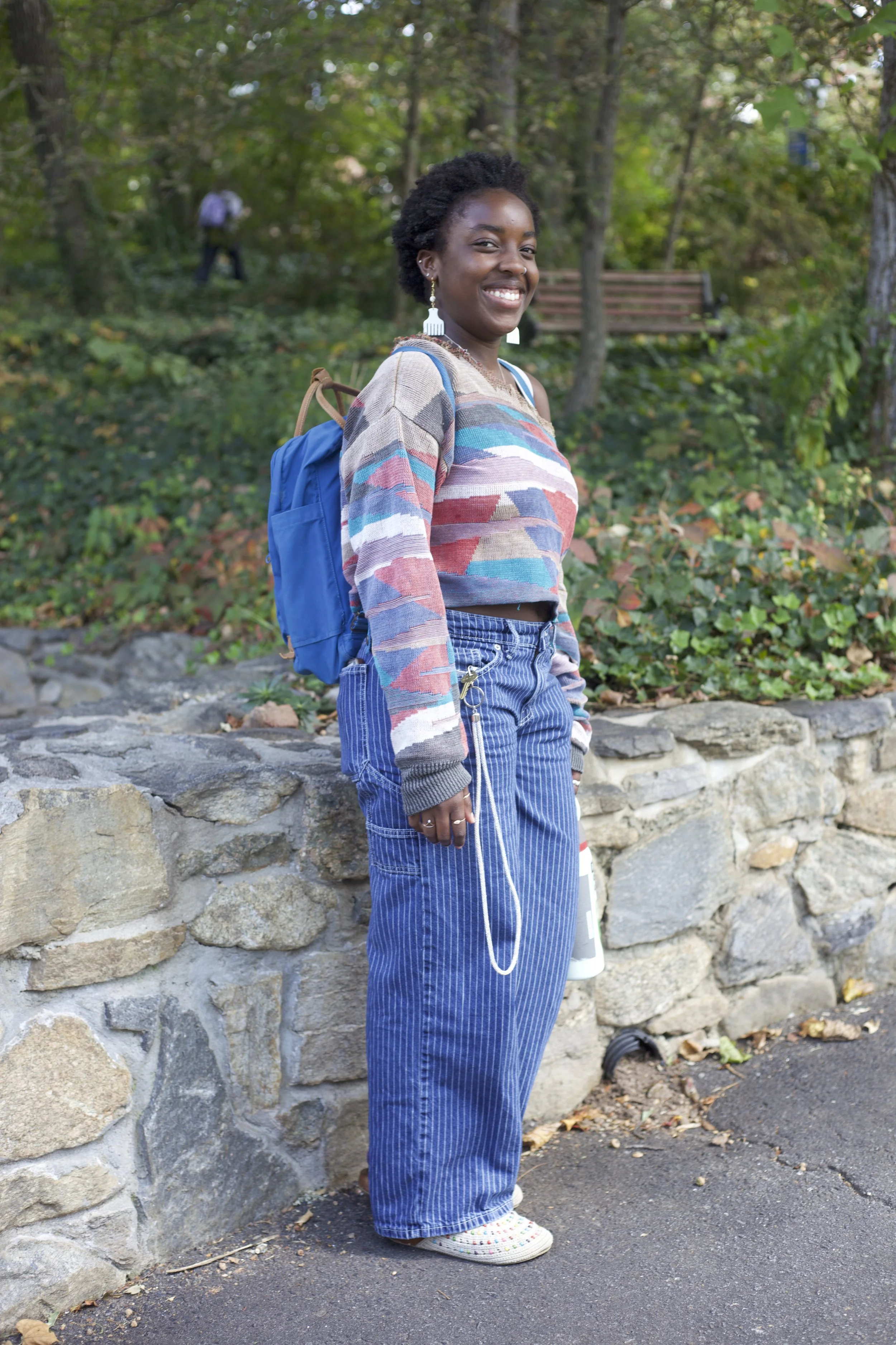 Beaded shoes, rings and earrings compliment Pendo Dawe’s bright smile.