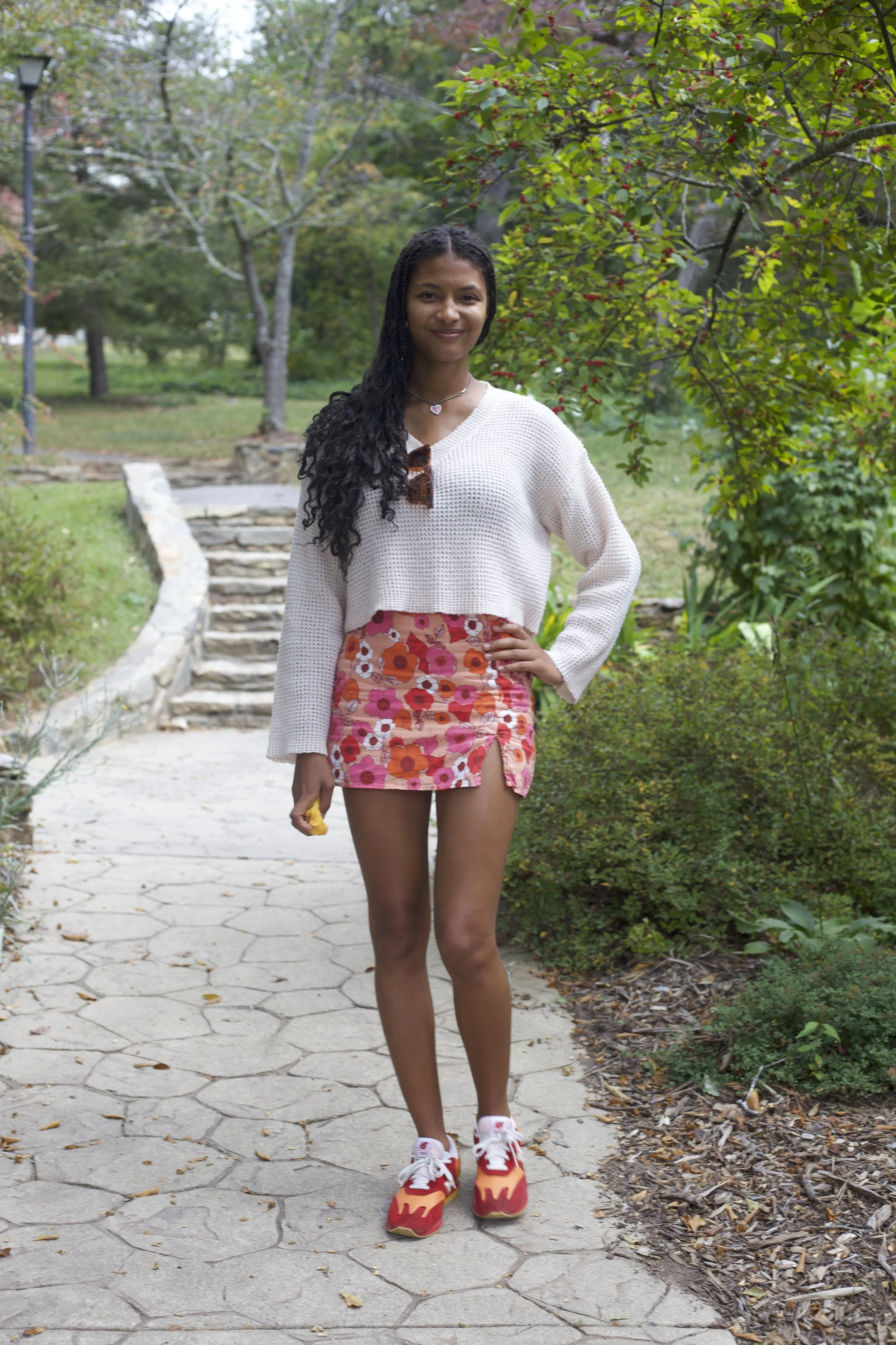 Dechen Dyson-Marshall ’s all-thrifted outfit features a bright fall colored skirt and matching shoes.