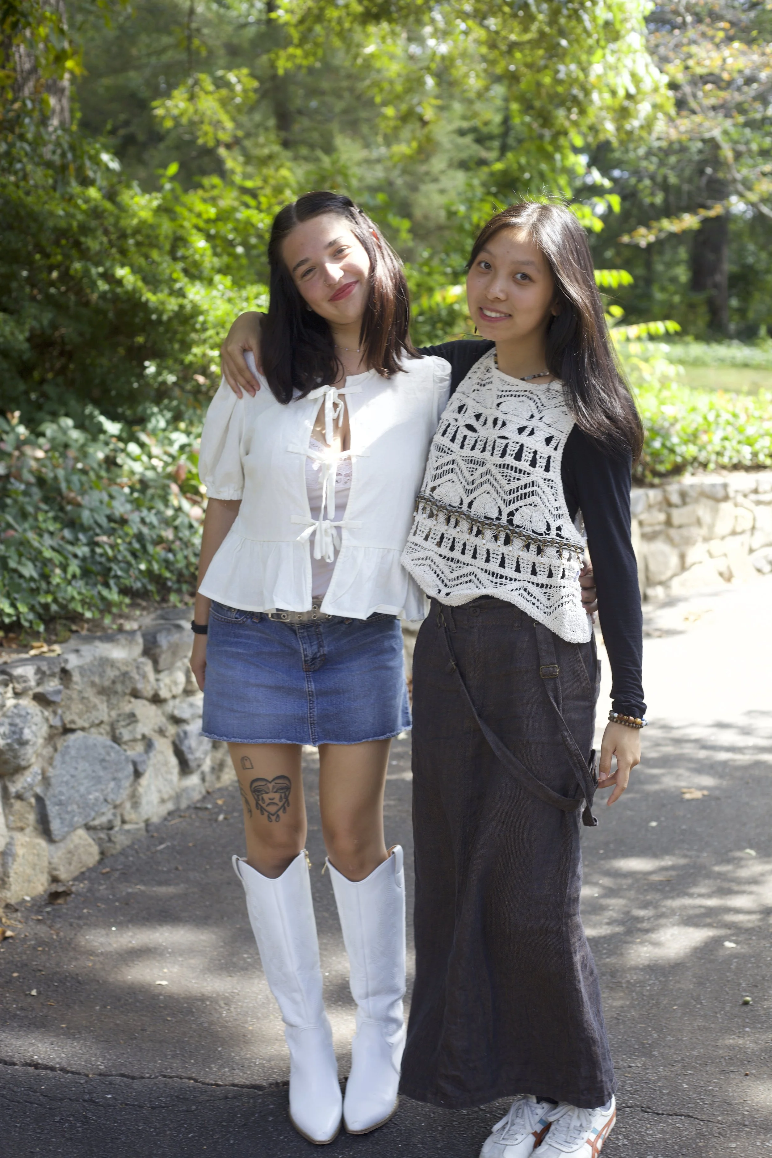 Carmella DelCogliano’s white boots and blouse match Ziting Fan’s lacy top and shoes.