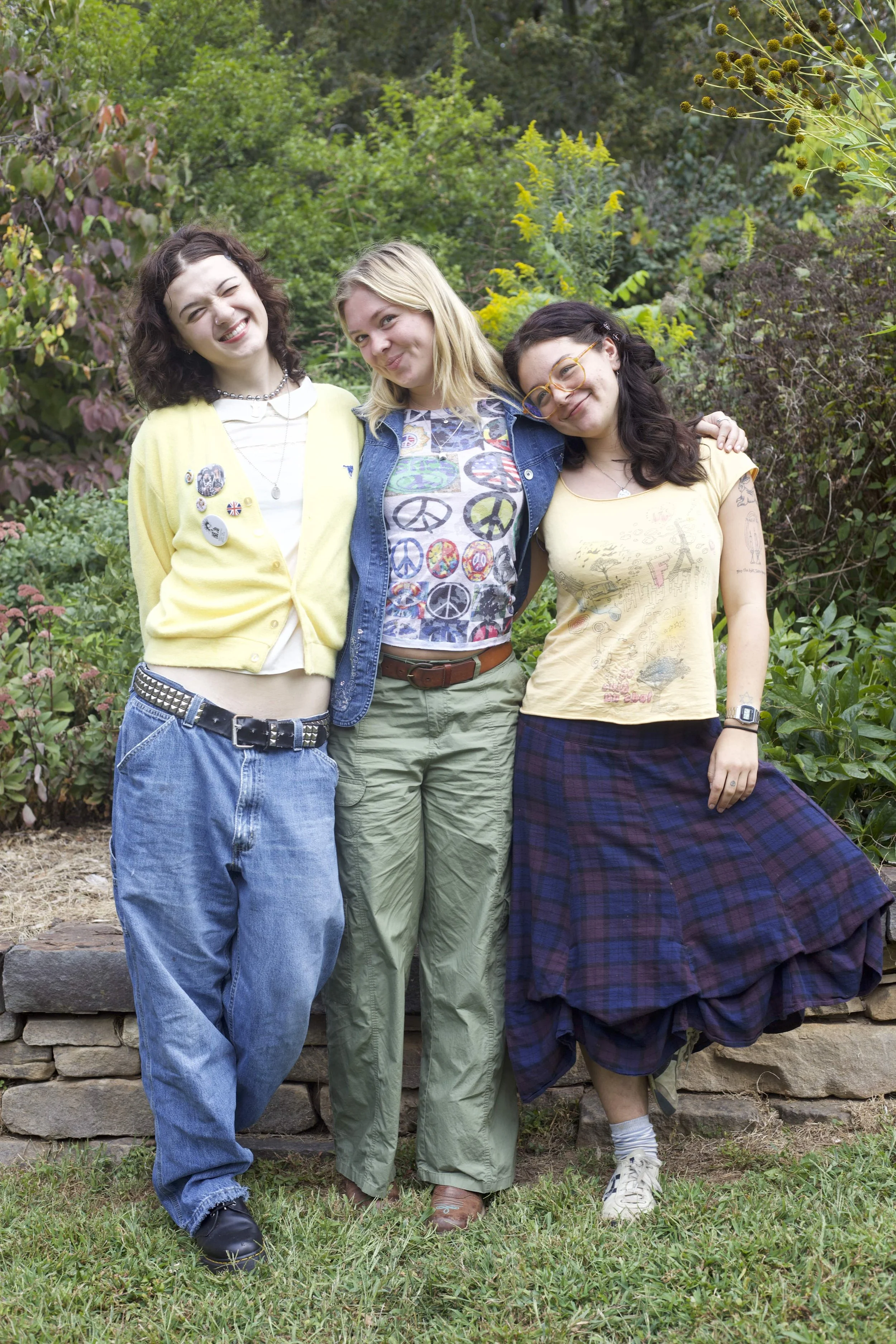 Ellie Rice , Izzy Strode and Shoshana Caldas mix prints and pins on Cowpie lawn.