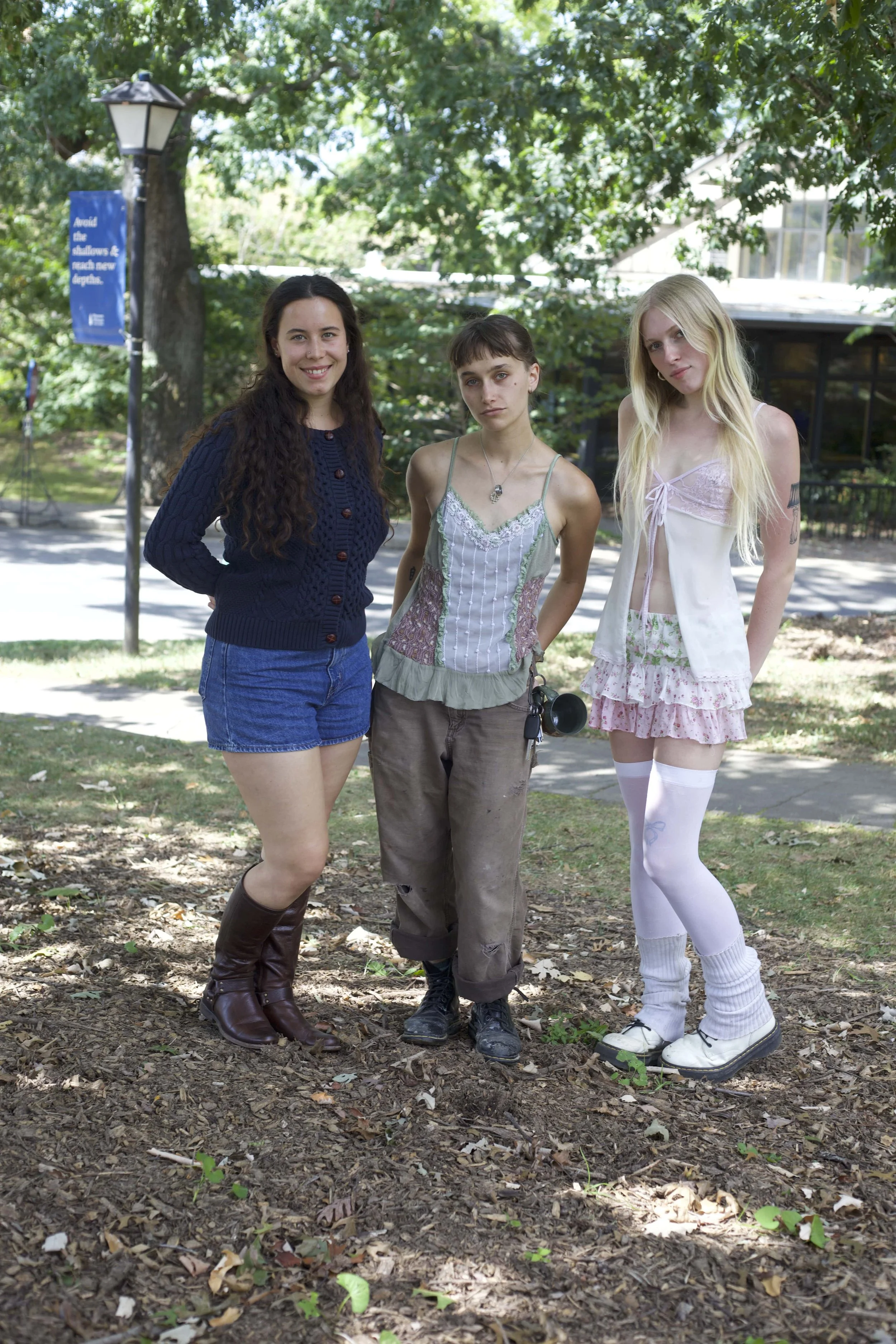 Carly McCabe , Ivy Libby and Evan Mercado , show off a variety of classy boots and a ceramic mug.