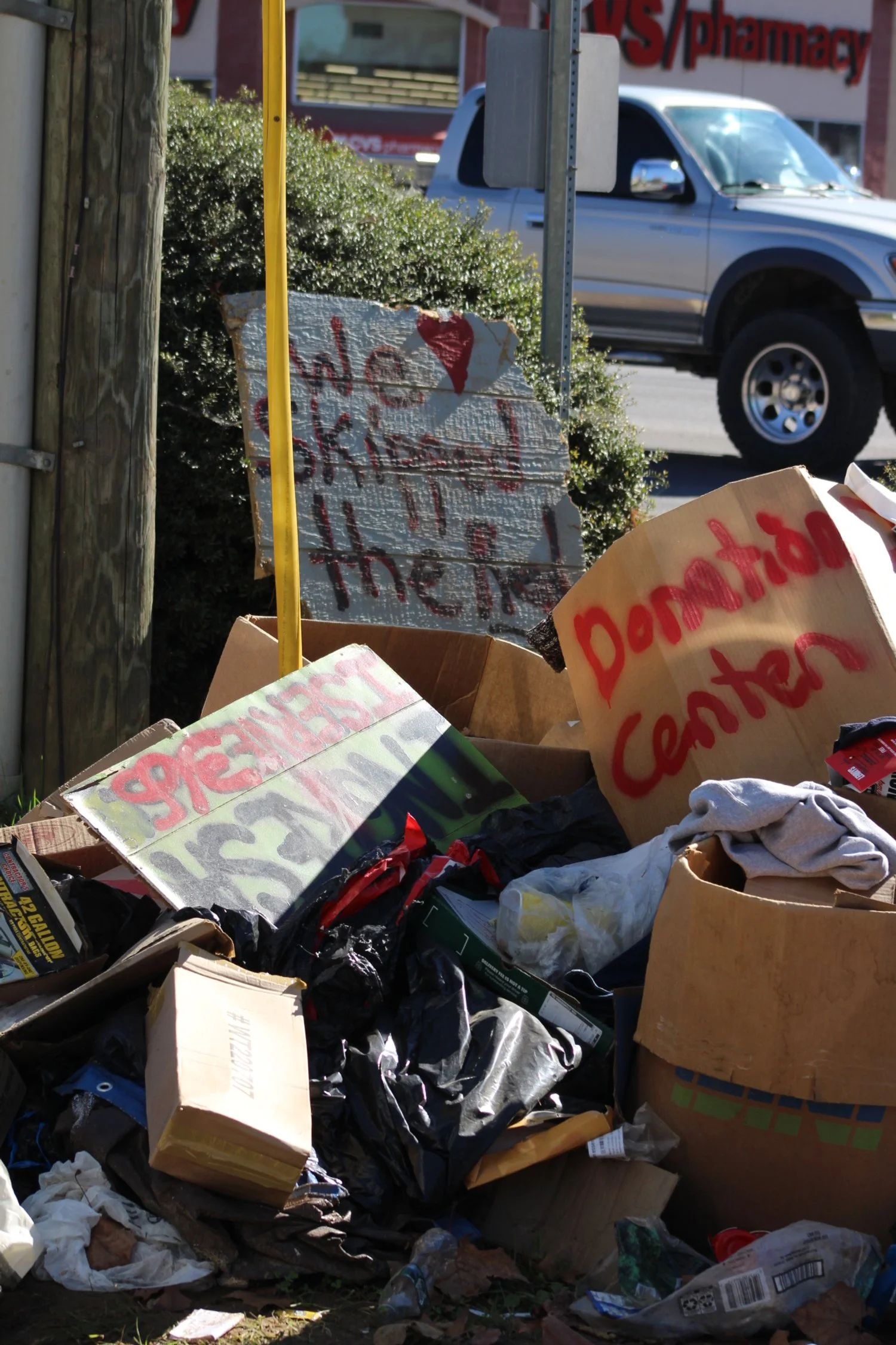  Boxes and signs piled in the corner of a donation center in Swannanoa, N.C., on Nov. 16, 2024. (Vivian Bryan/Echo) 