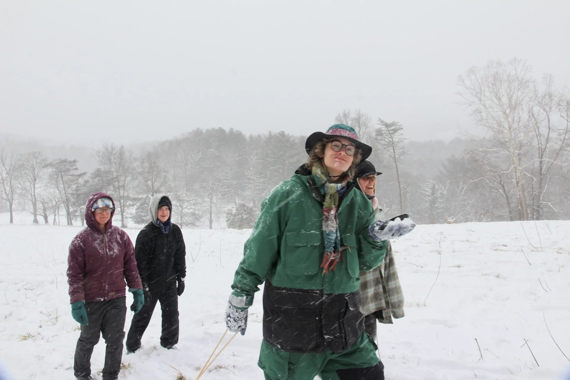  Warren Wilson College students trek up a snowy hill at Dogwood Pasture in Swannanoa, N.C., Jan. 31, 2025. (Vivian&nbsp; Bryan/Echo)    