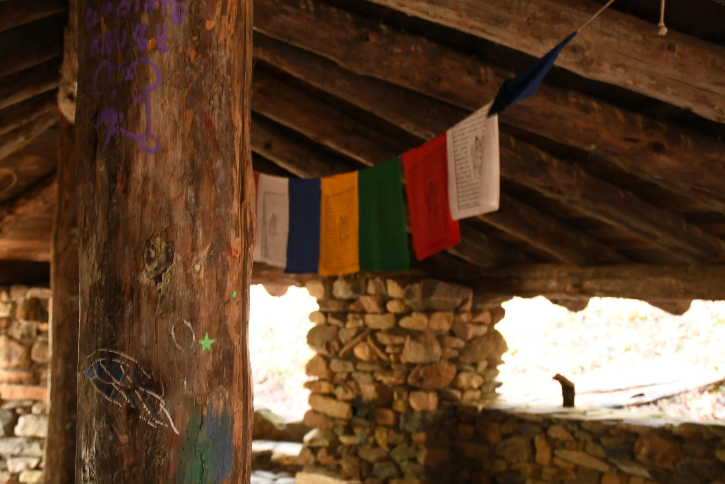  Interior of Meditation Hut with colorful banners, Warren Wilson College (WWC) campus in Swannanoa, N.C., on Feb. 27, 2026. (Echo News/Richmond Joyce) 