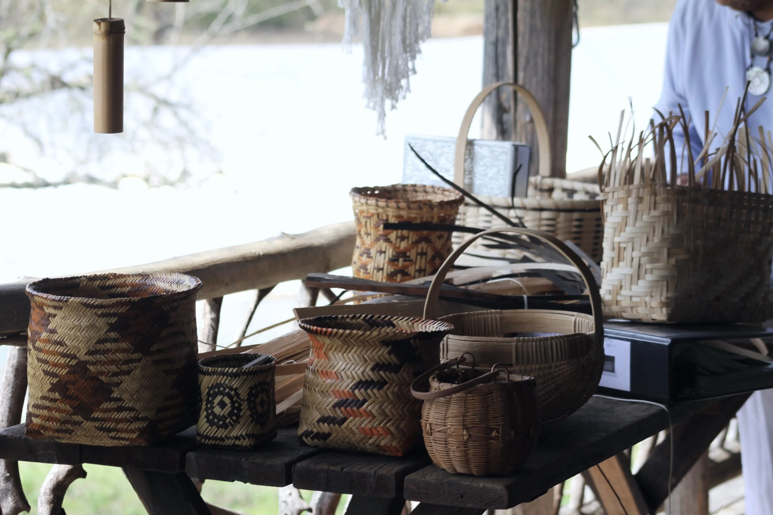  Cherokee artist Mary Thompson’s baskets sit on display at the Garden Cabin during a demonstration at Warren Wilson College in Swannanoa, N.C. (Vivian Bryan/Echo)&nbsp;    