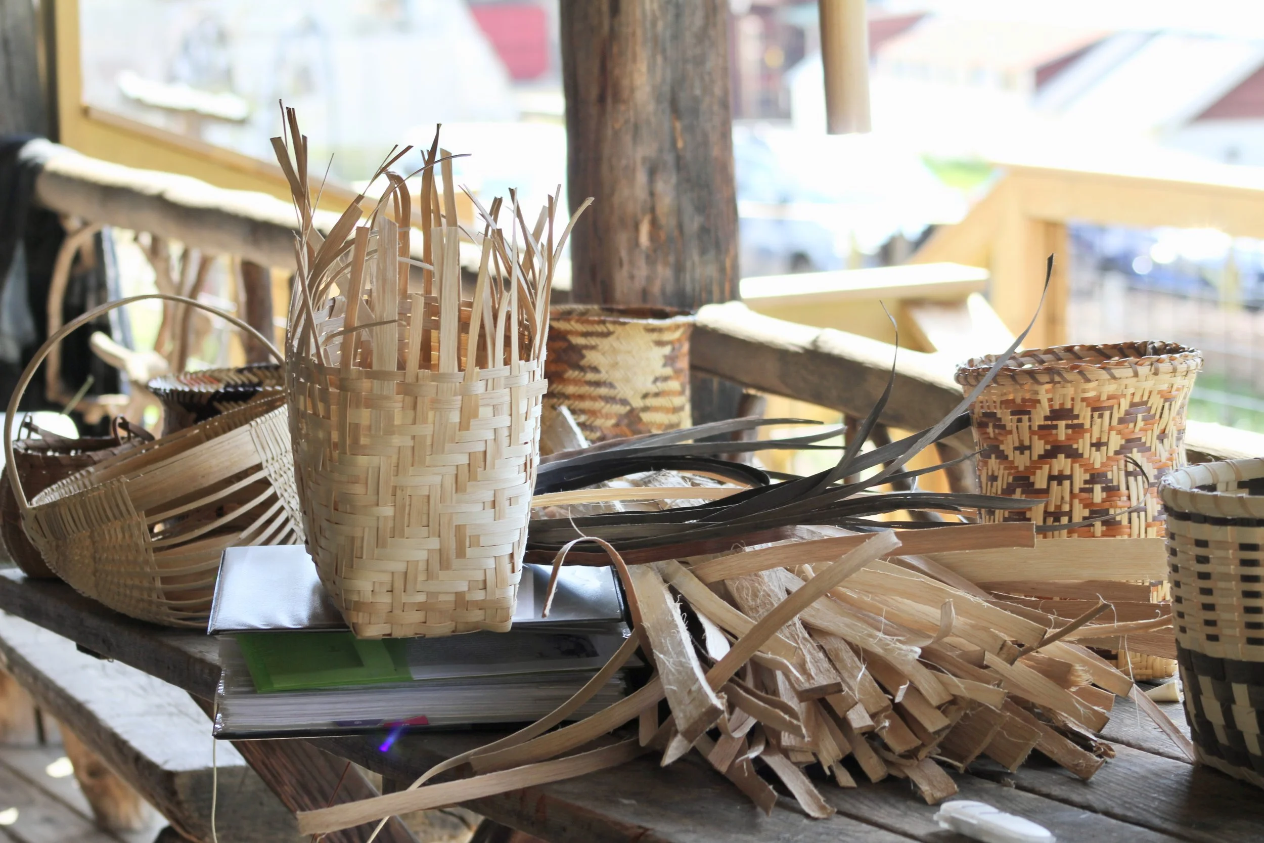 Mary Thompson’s white oak baskets and wood splints are displayed on a table in the Garden Cabin during a workshop at Warren Wilson College in Swannanoa, N.C., on March 26. (Vivian Bryan/Echo) 