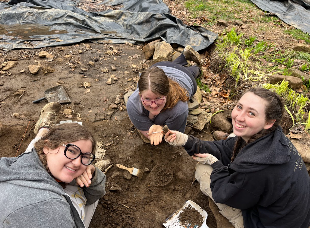  One excavation unit’s crew holding piece of found tobacco pipe at Boyd Cabin in Sandy Mush, Buncombe County NC on Mar. 11, 2026. (Echo News/Scotti Norman) 