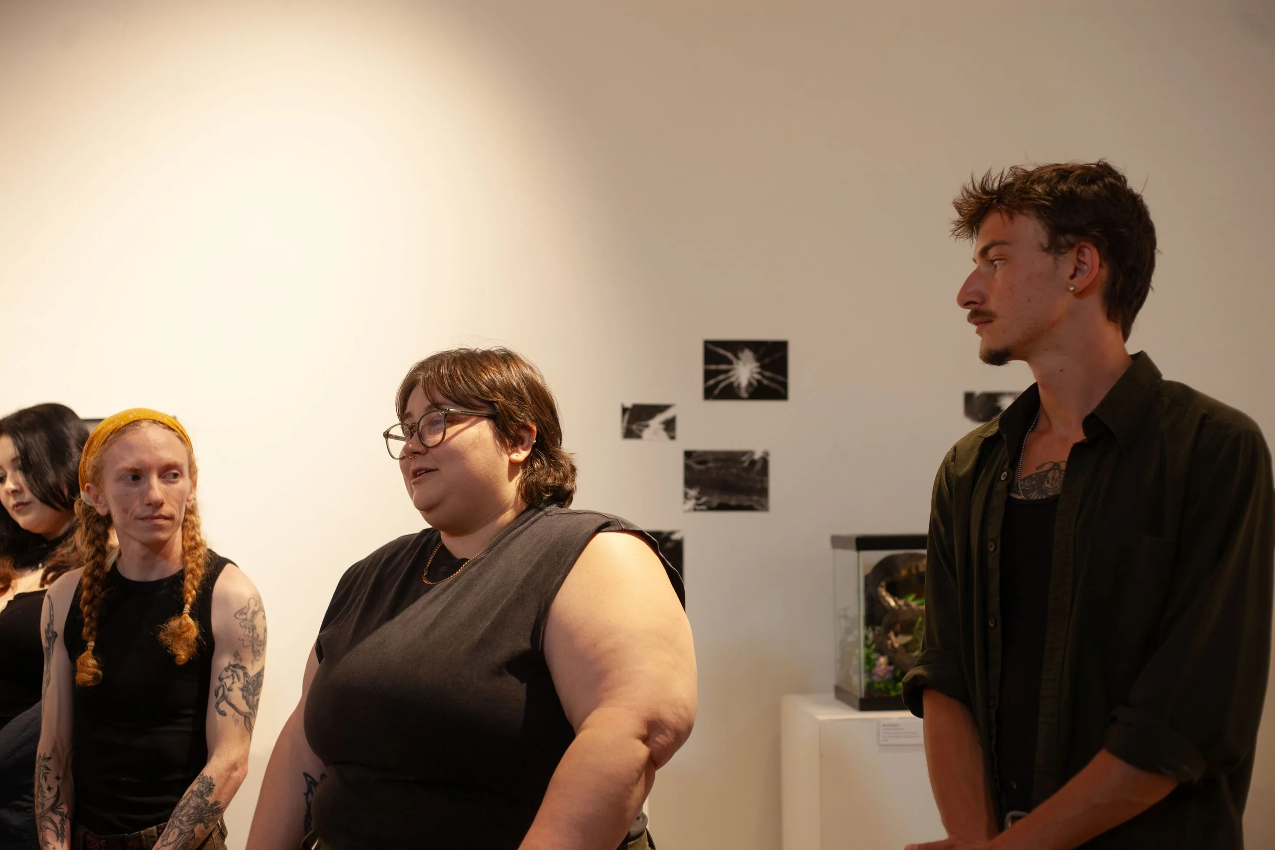  From left to right: Ennis Shepherd, Kimber Gada and Goob Jefferson give their artist statements at the “Perspective” show in Swannanoa, N.C. on April 3, 2026. (Echo/Emma Taylor McCallum) 