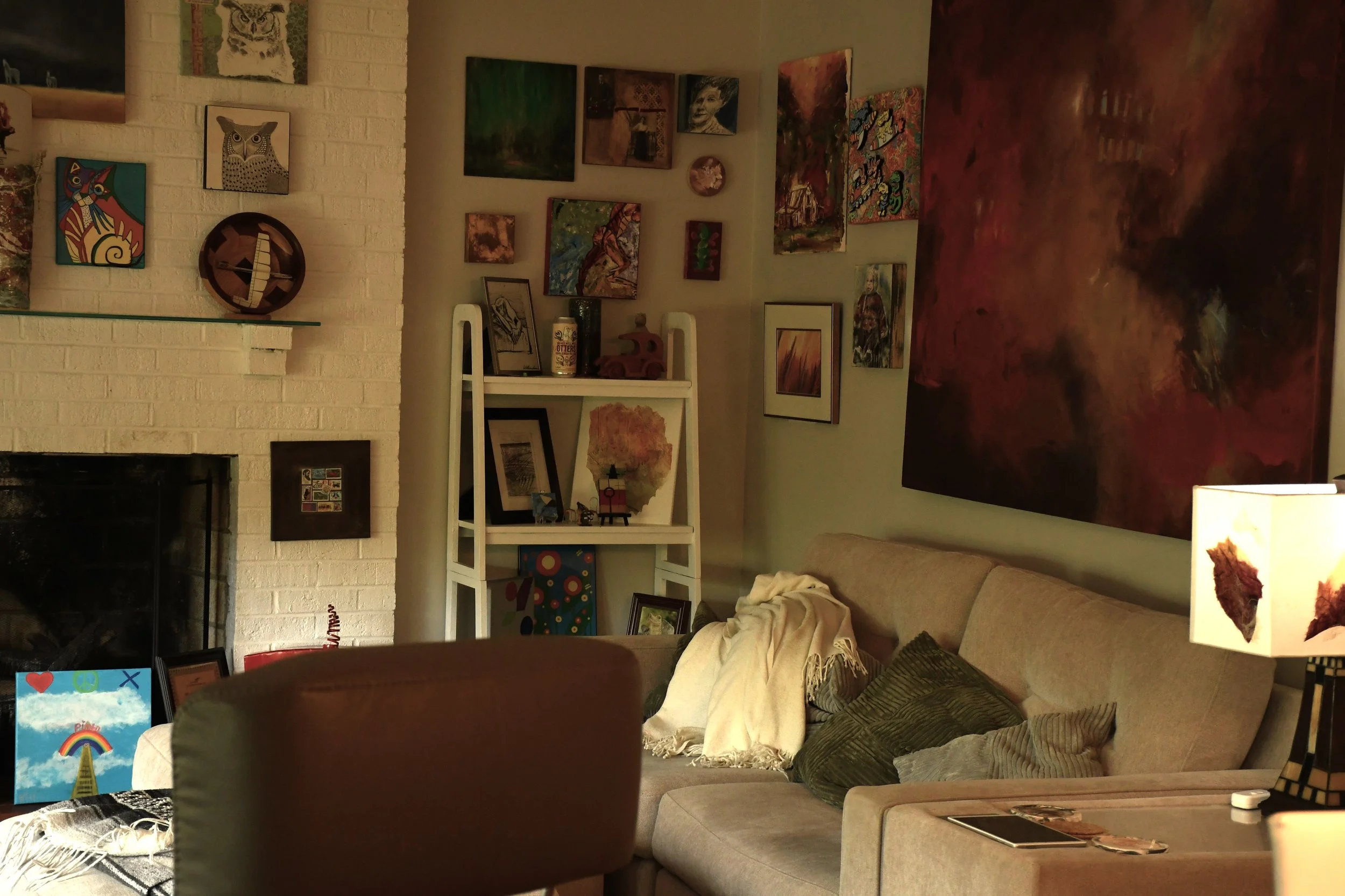  Kam Kammerer and his husband Bill Dill's living room full of art made by friends and community at their home in Tryon, North Carolina on April 2, 2026. (Echo News/Richmond Joyce) 