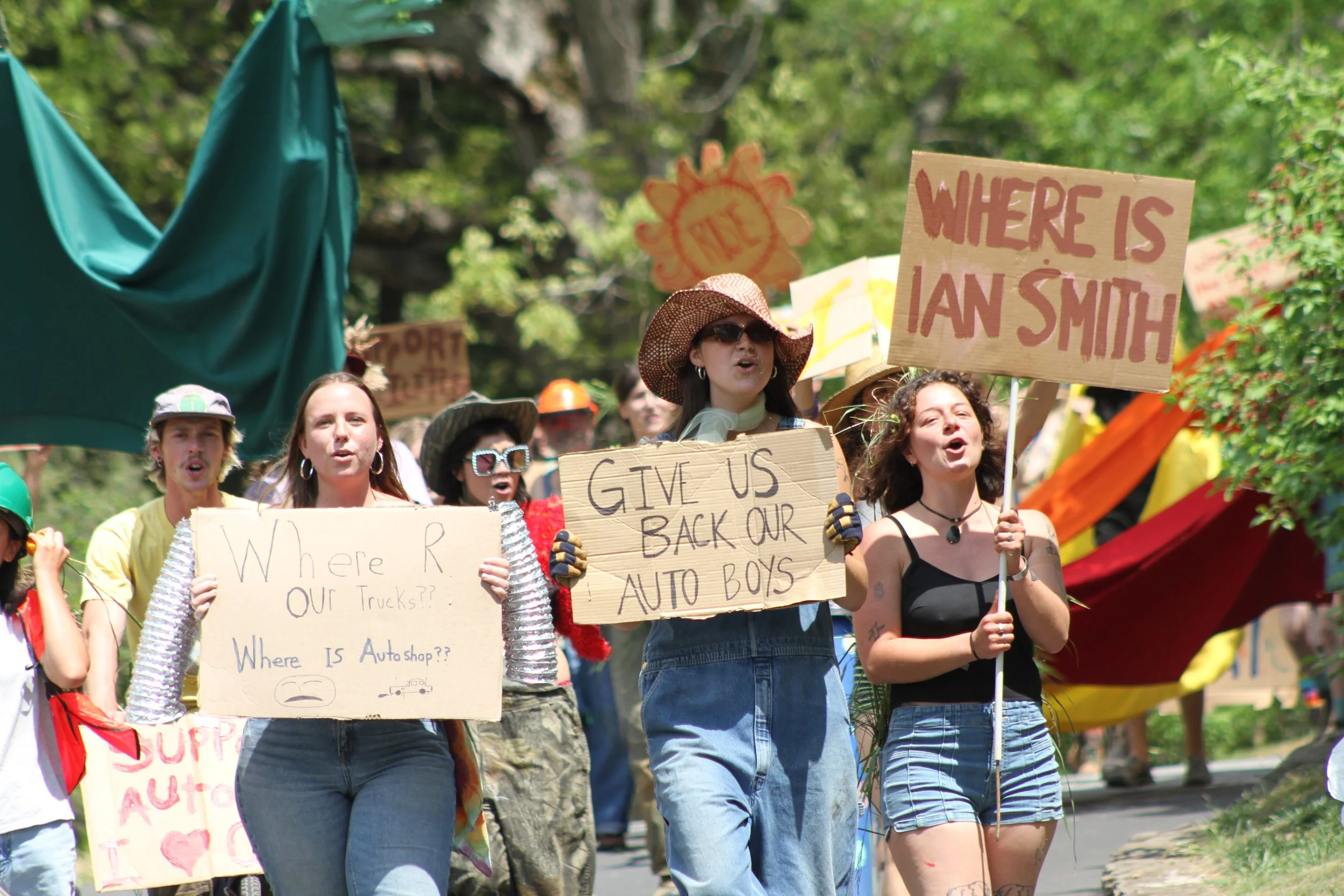  Students protest the Warren Wilson College administrations’ actions towards the Autoshop during the annual Big Gay Earth Day parade on April 24, 2026 in Swannanoa, N.C. (Echo/Vivian Bryan) 