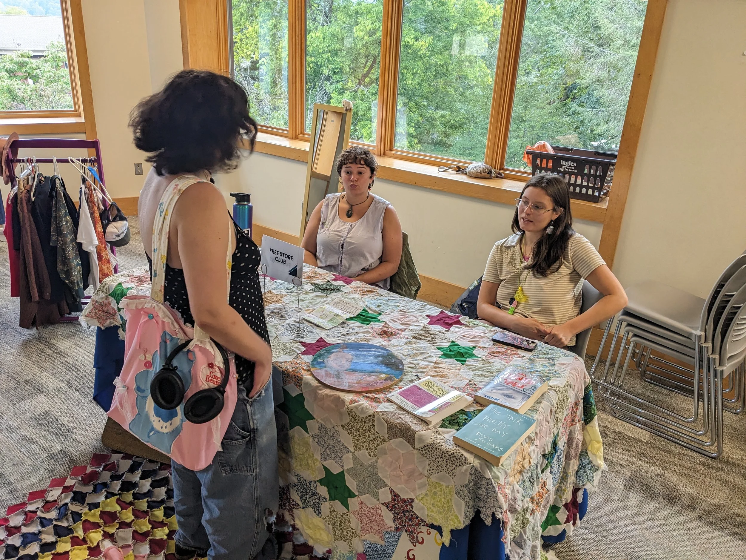  Sustainability and Resilience Crew supervisor Fae Elkin and Warren Wilson College student Zea Lopez Bird speak to a prospective club member about the Free Store club during the club fair in Canon Lounge in Swannanoa, N.C., Wednesday, Aug. 26, 2026. 