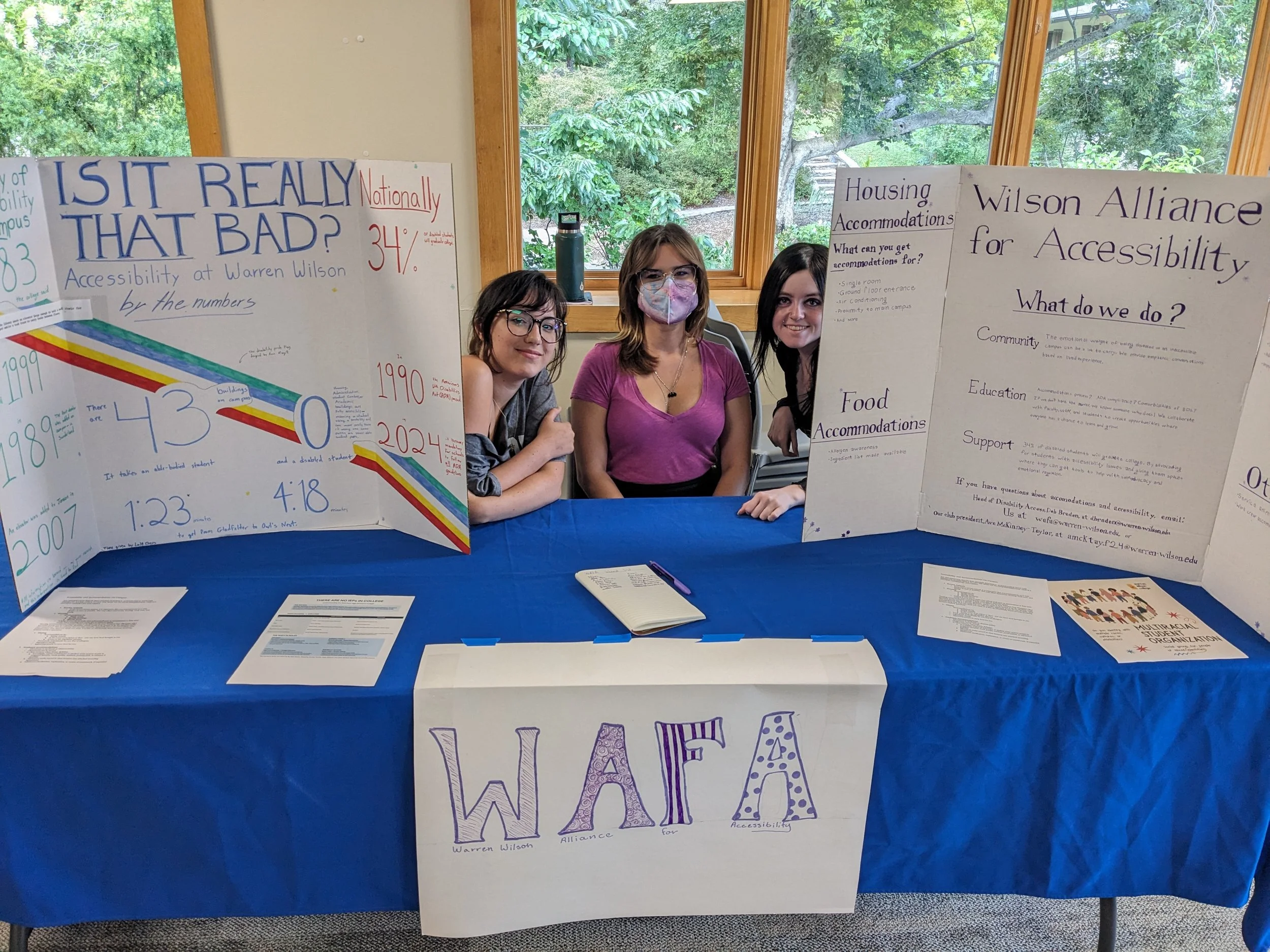  Warren Wilson College students Eva Carter, Ava McKinney-Taylor and Emerson Hood table for the Wilson Alliance For Accessibility (WAFA) club during the club fair in Canon Lounge in Swannanoa, N.C., Wednesday, Aug. 26, 2026. (The Echo/Clara Shirley) 